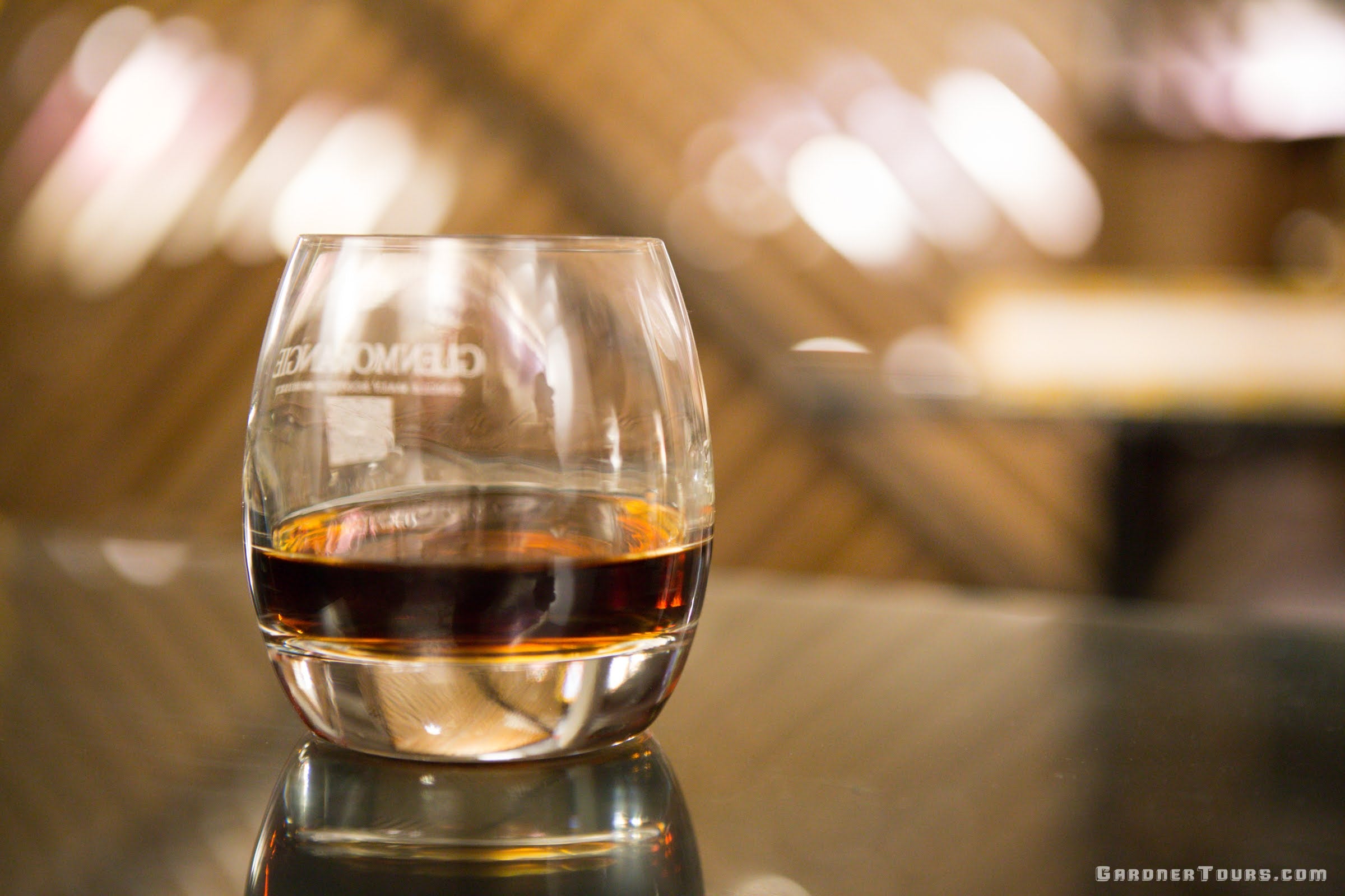 A Nice Glass of Aged Cuban Rum on a Glass Table in Havana, Cuba