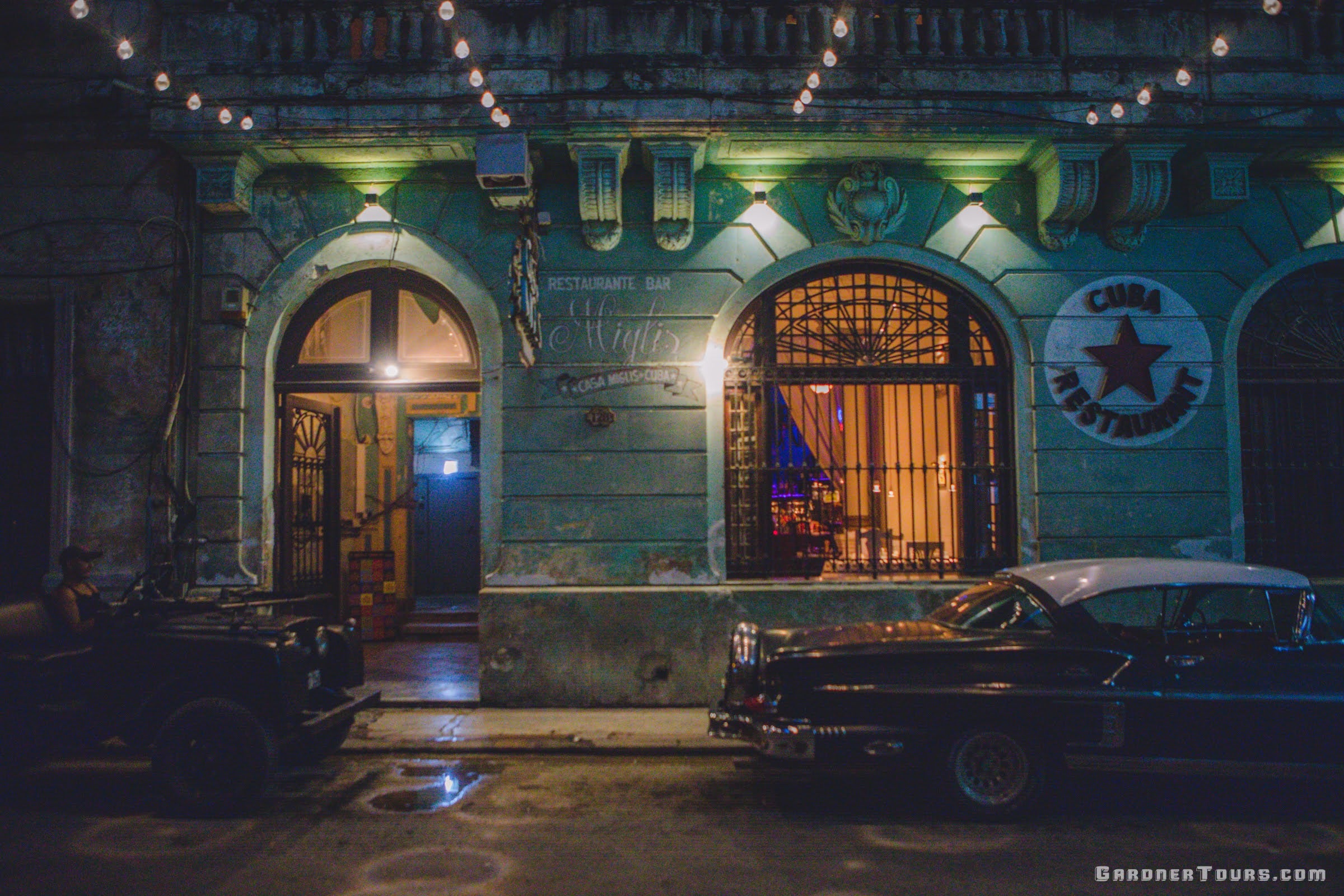 Classic Cars outside of Casa Miglis Restaurant and Bar in Havana, Cuba