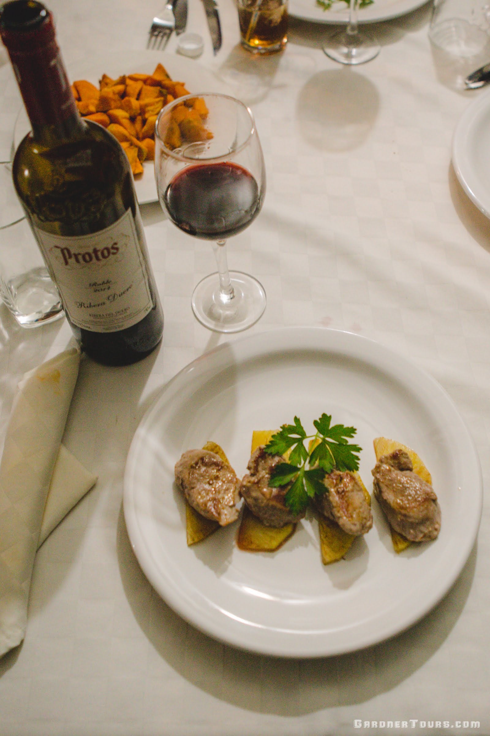 Delicious Pork Loin on Glazed Pineapple, Sweet Potato Fries, and a Bottle of Protos Red Wine at a 5-Star Restaurant in Cuba