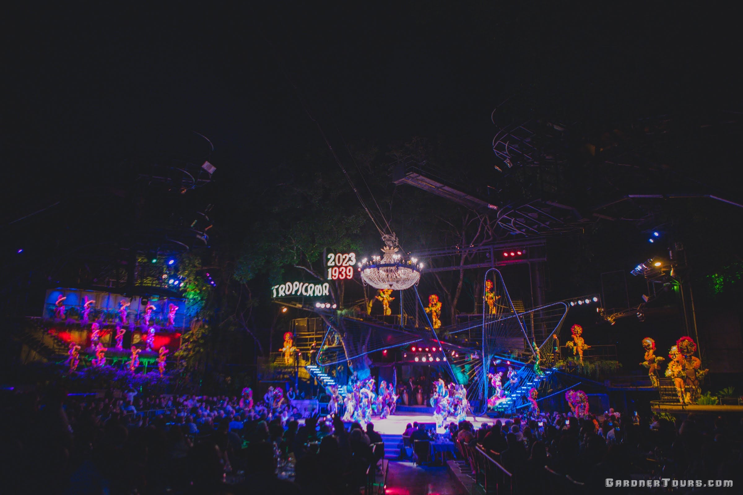 A wide view of the entire stage and all colorful performers at the Tropicana Cabaret's Big Show in Havana, Cuba in 2023