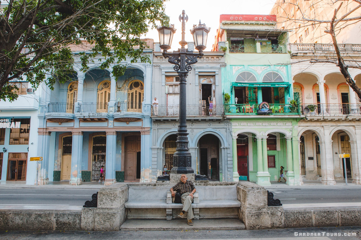 Gardner Tours Luxury Cuba Tours Custom Tour Man Taking an Afternoon Nap in the Prado in Havana Cuba