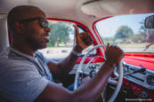 Gardner Tours Michel Cuban Taxi Driver giving a thumbs up in his Red Classic Car