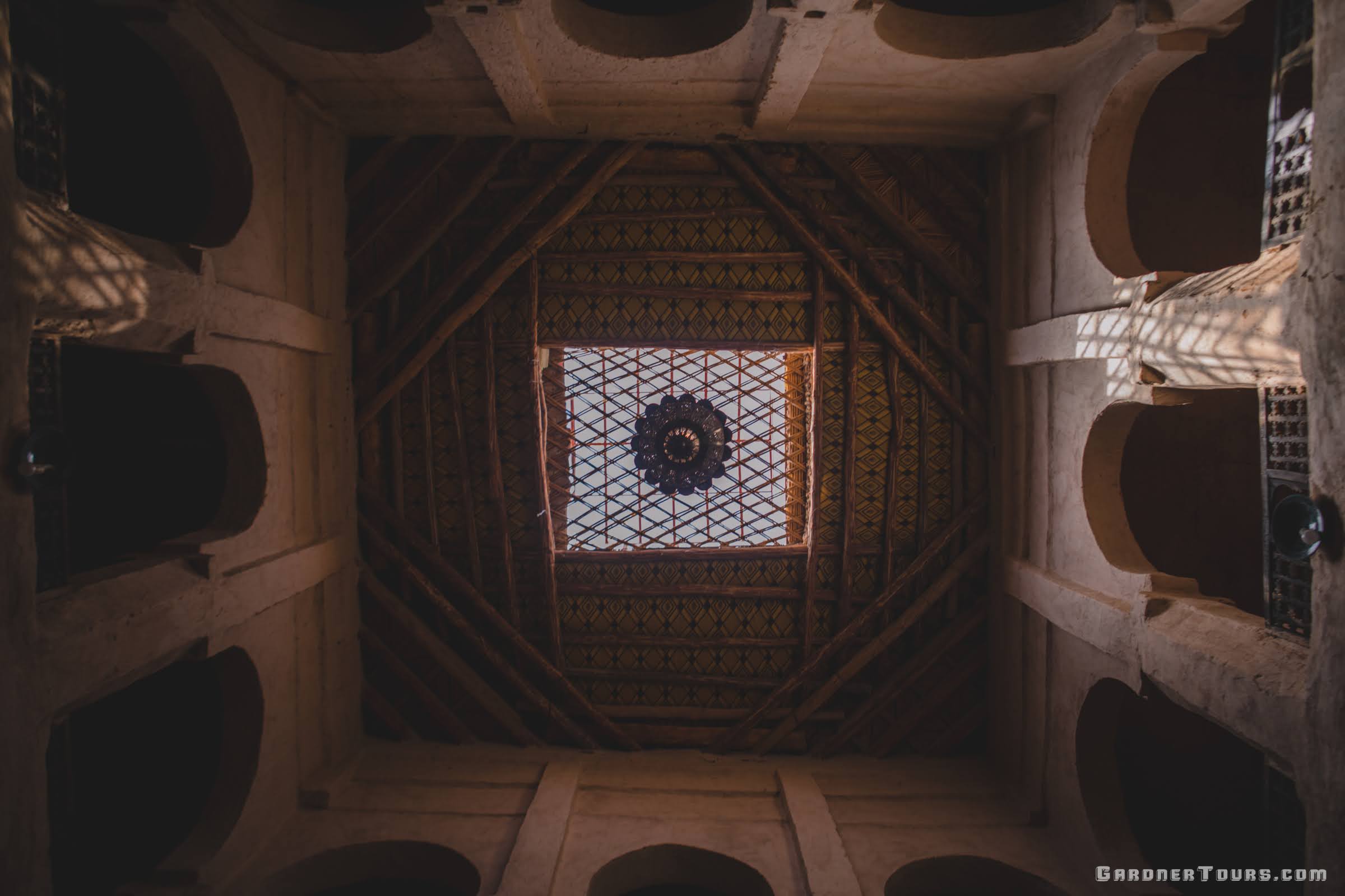 An incredible view from the floor up to the ceiling of an ancient mosque in Morocco