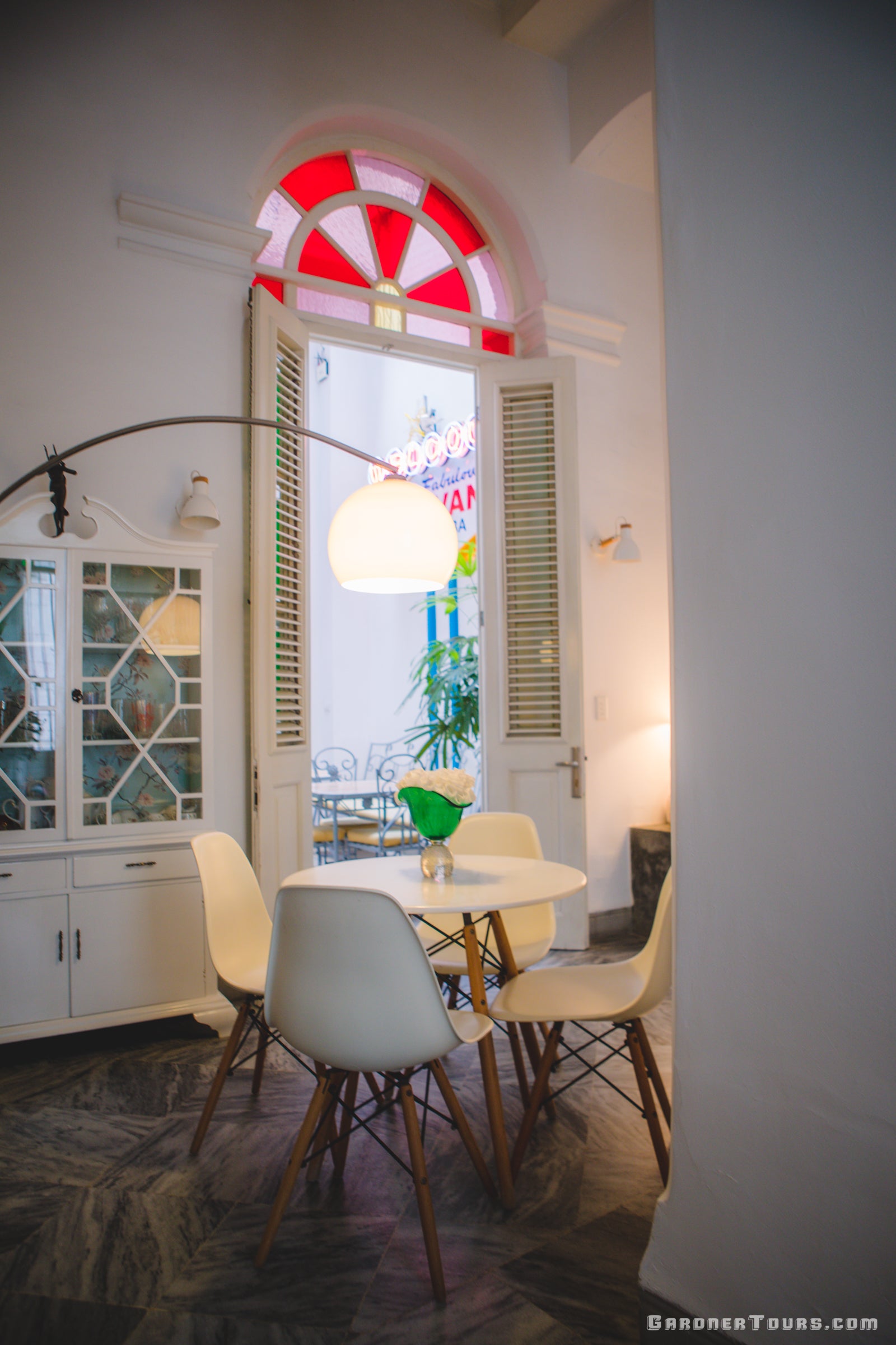 Sitting Room with Table and Chairs and Stained Glass in 4-Star BnB in Old Havana, Cuba