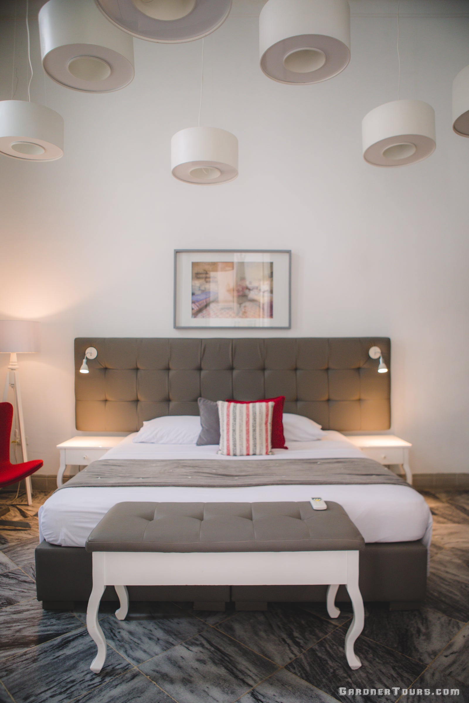 Luxurious Bedroom with Lush Bed and Hanging Lights in 4-Star BnB in Old Havana, Cuba