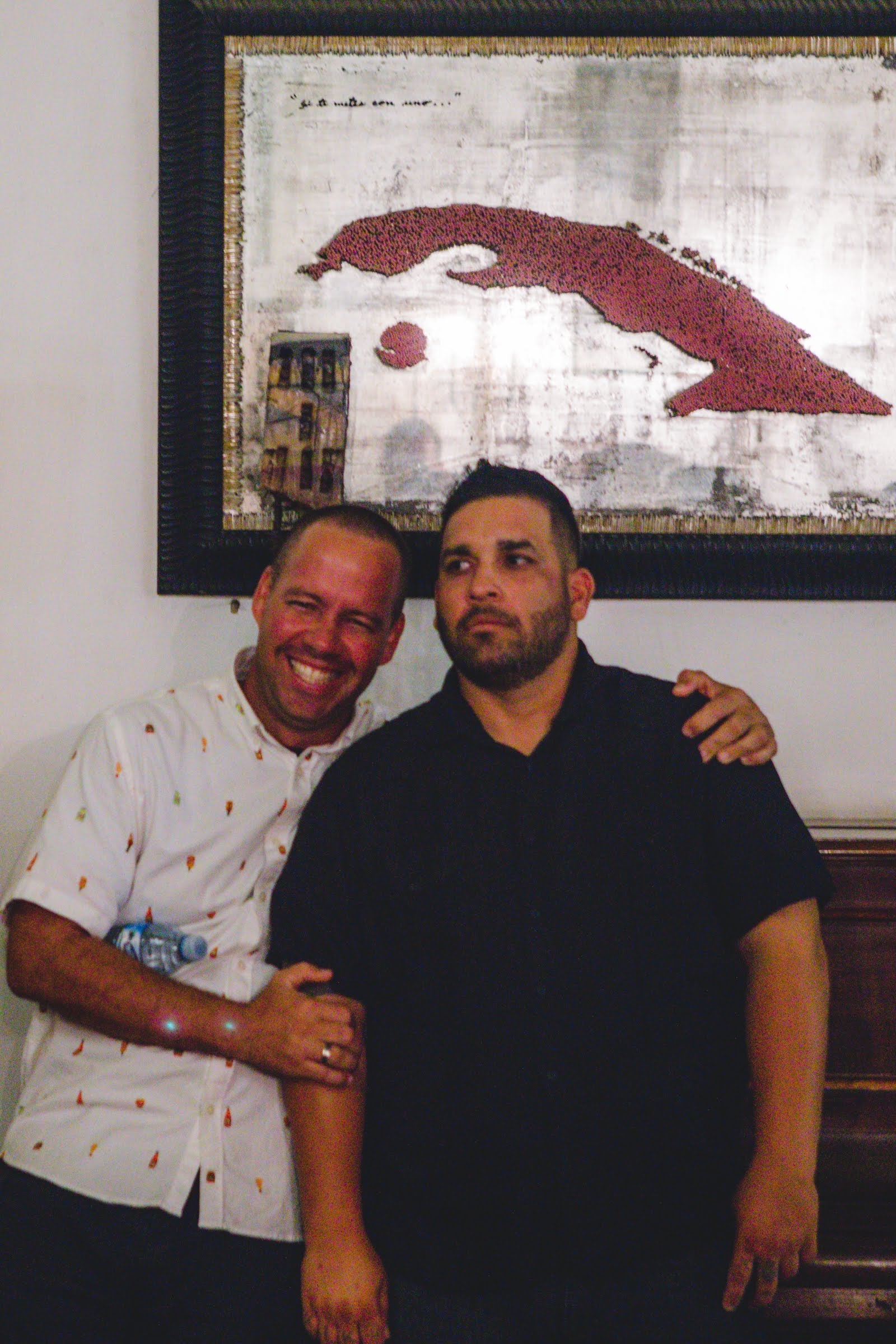 Gardner Tours Cuban Tour Guide Albert and Yunior being goofy in a photo together in a casa particular in Old Havana, Cuba