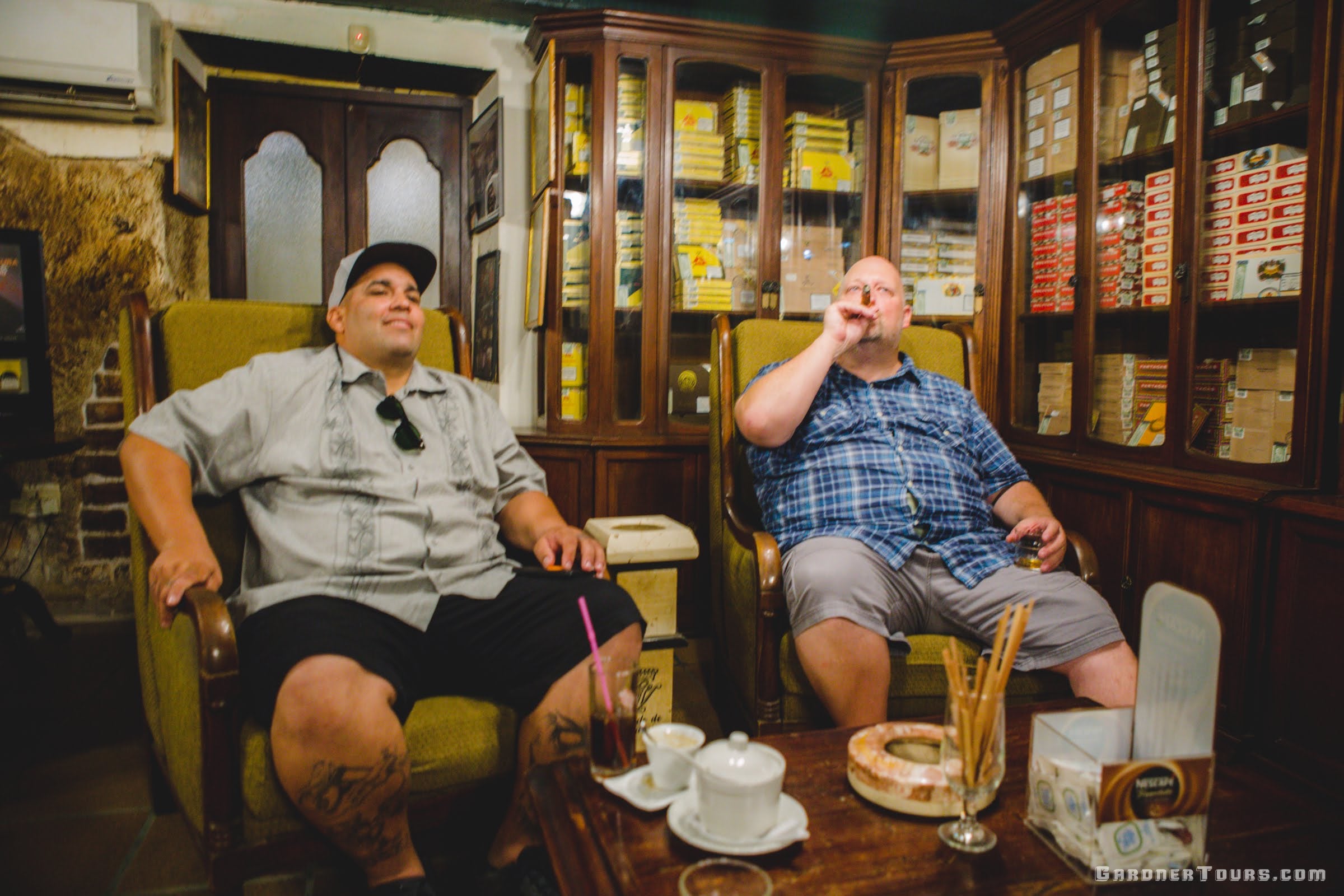 Gardner Tours Cuban Tour Guide Albert leading a maridaje cigar pairing at the Conde de Villanueva Cigar Shop in Old Havana, Cuba