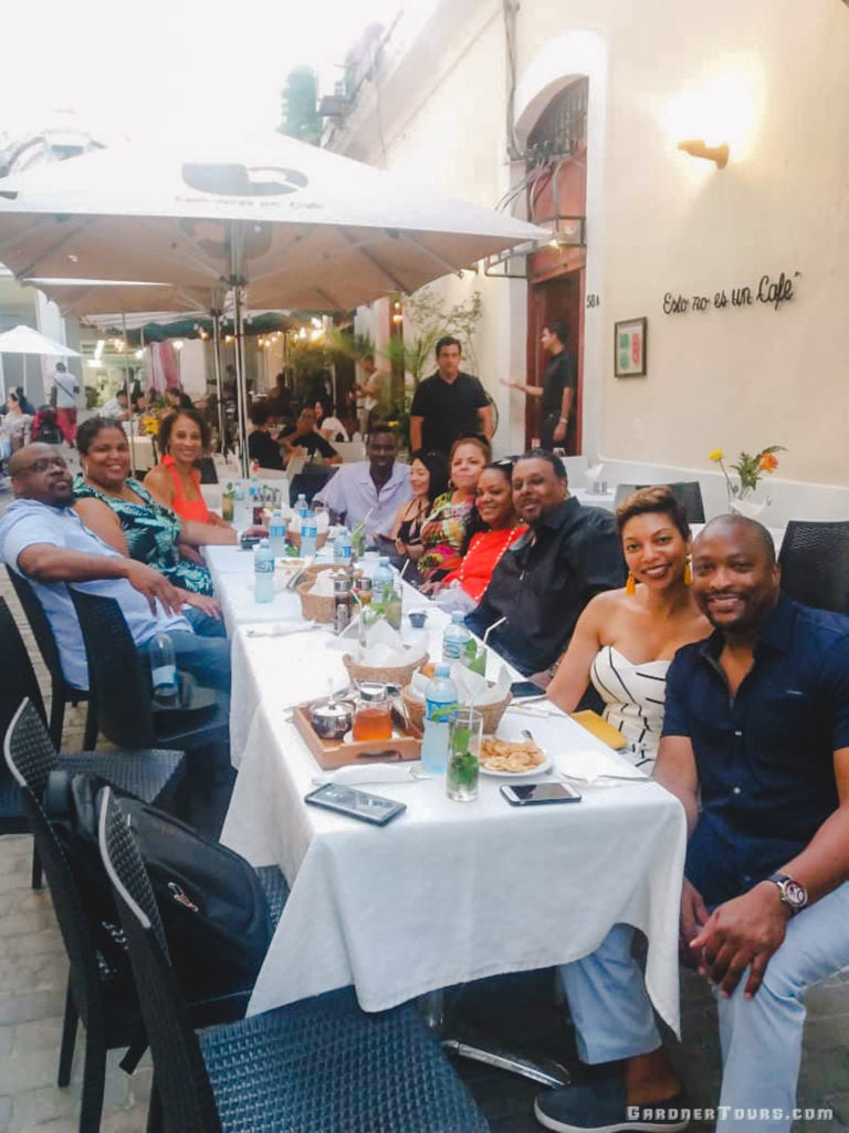 Gardner Tours Cuban Tour Guide Carlos with his travelers at Esto no es un Café in Old Havana, Cuba