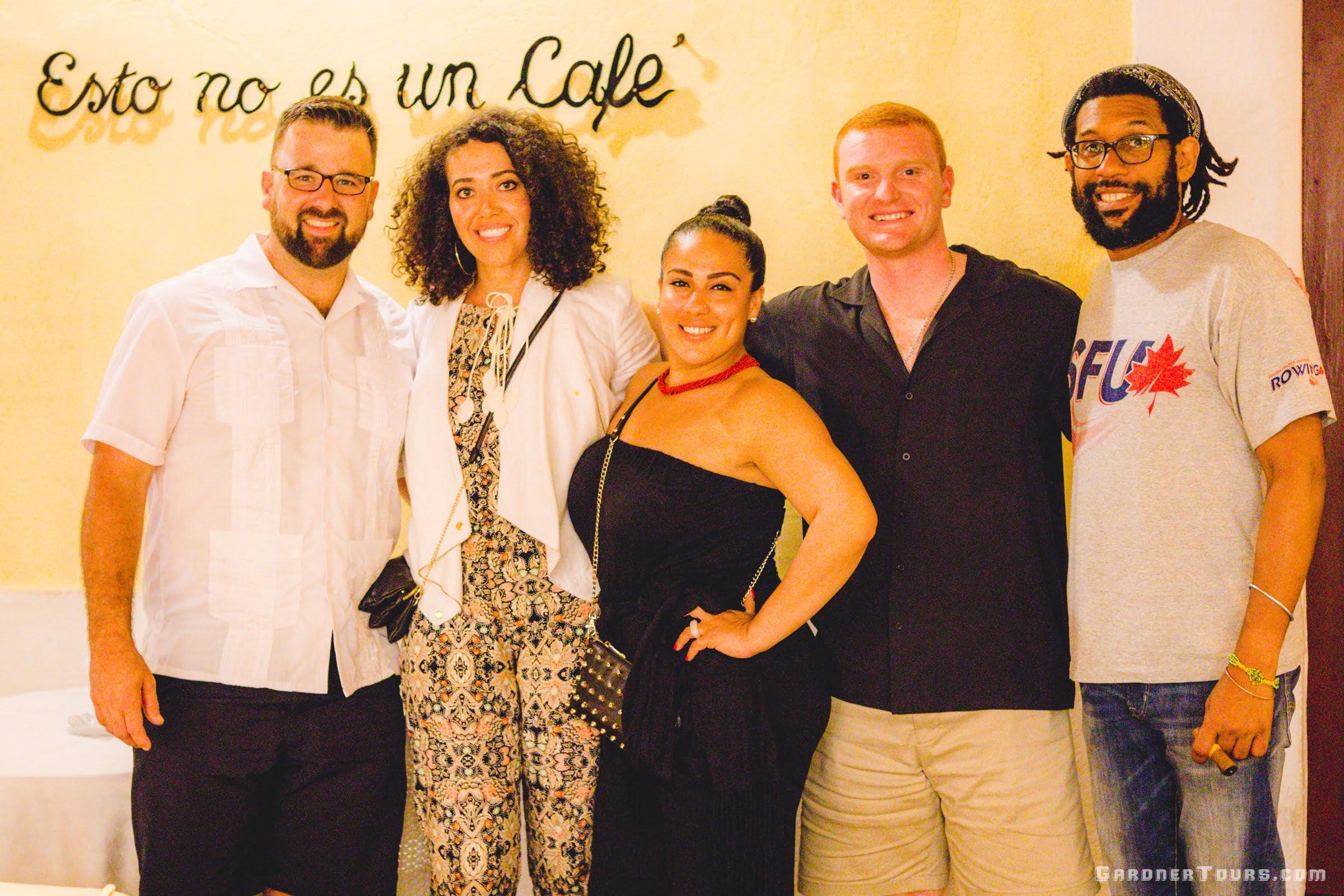 Gardner Tours Owner and Tour Guide Colby Gardner smiling with his travelers at Esto no es un Café in Old Havana, Cuba