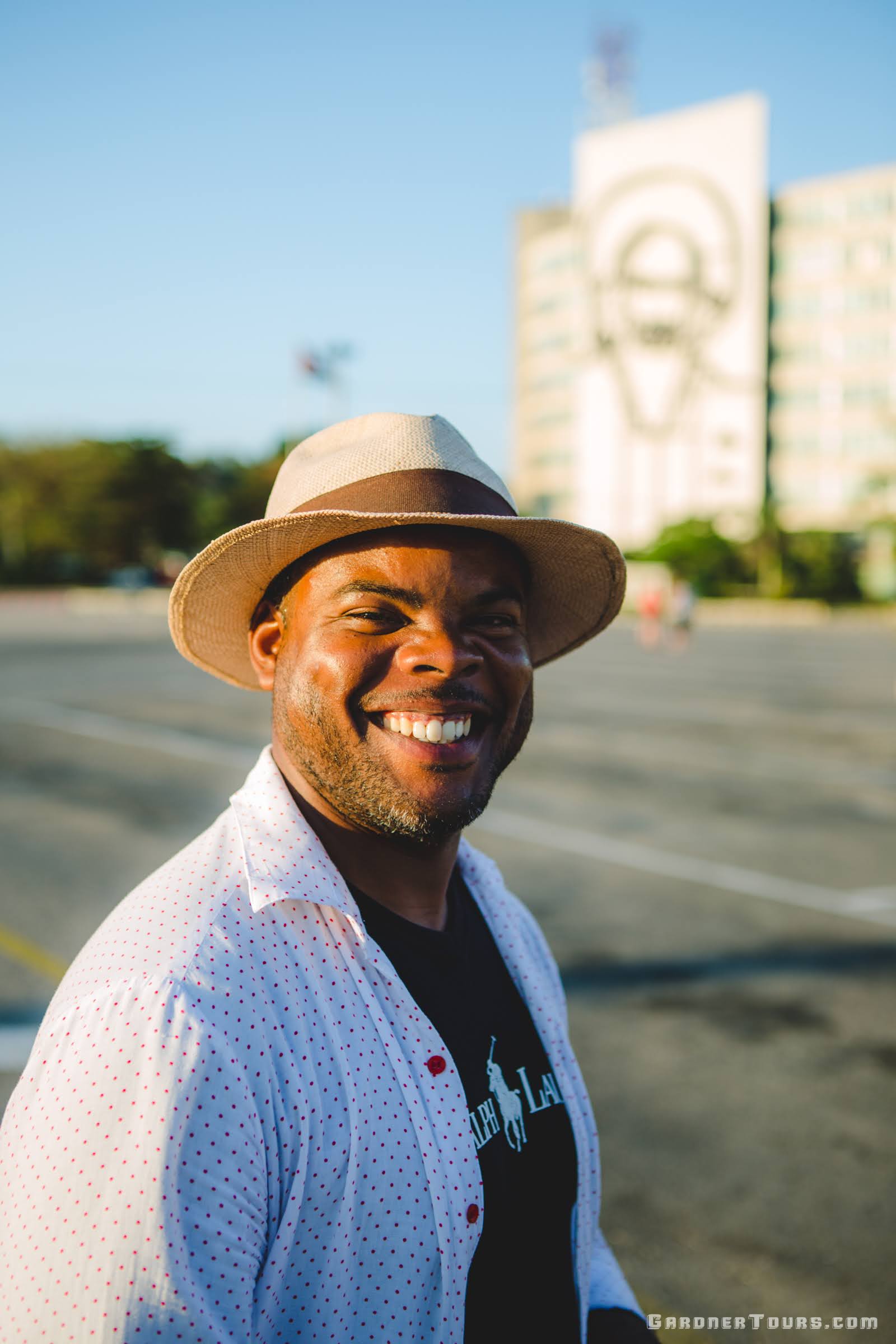Gardner Tours Cuban Tour Guide Michel Smiling big at the Plaza de Armas in Havana, Cuba
