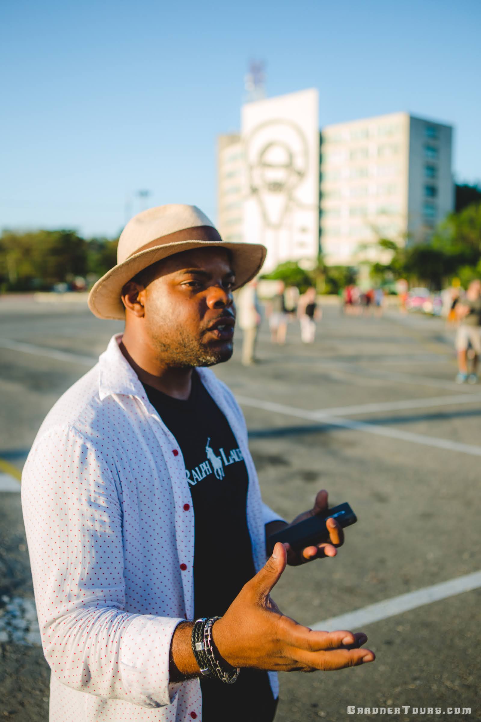 Gardner Tours Cuban Tour Guide Michel talking with his travelers about the significance of the Plaza de Armas in Havana, Cuba