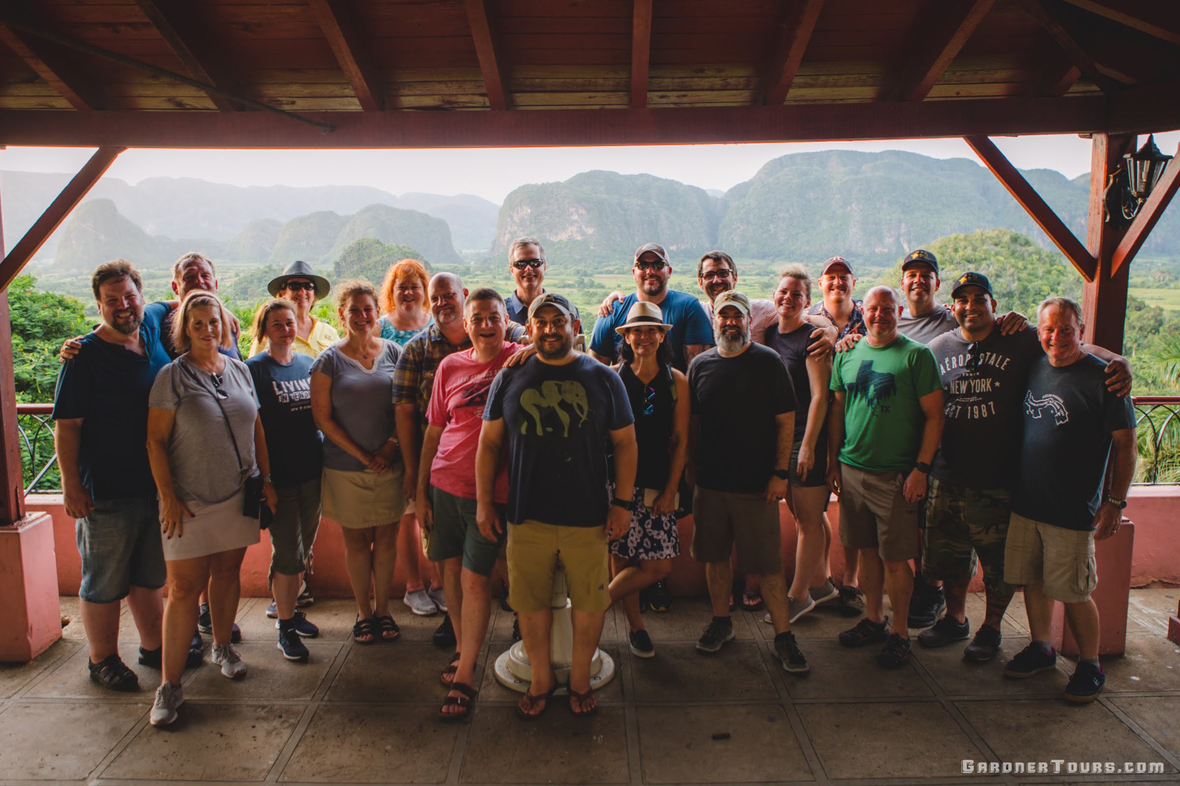 Gardner Tours Cuban Tour Guide Albert with a large group of travelers from the USA at the Los Jazmines Viewpoint in Vinales, Cuba