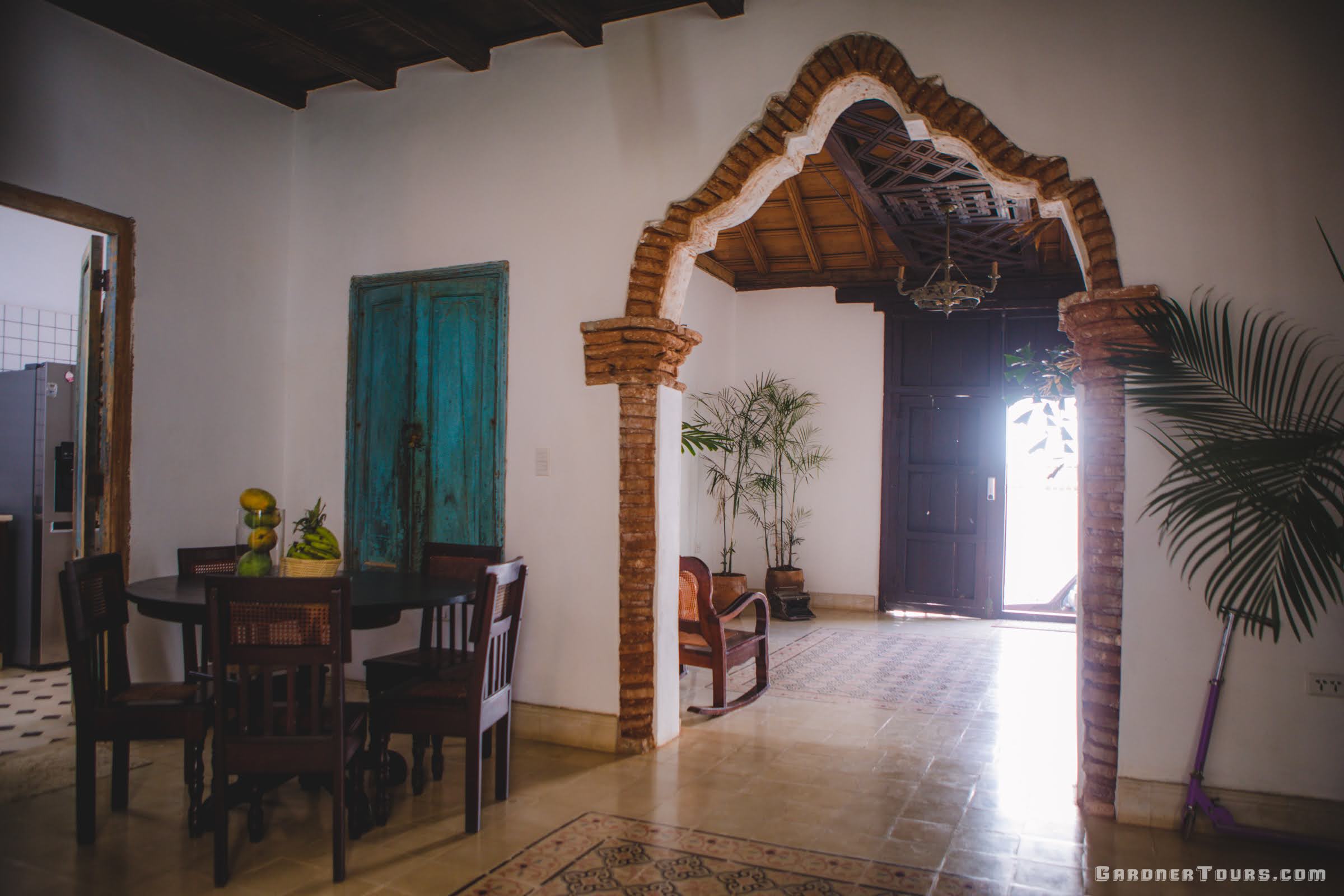 Cuba Luxury Tours Spacious Entryway with an ornate brick doorway at Jesus Maria 432 in Trinidad, Cuba