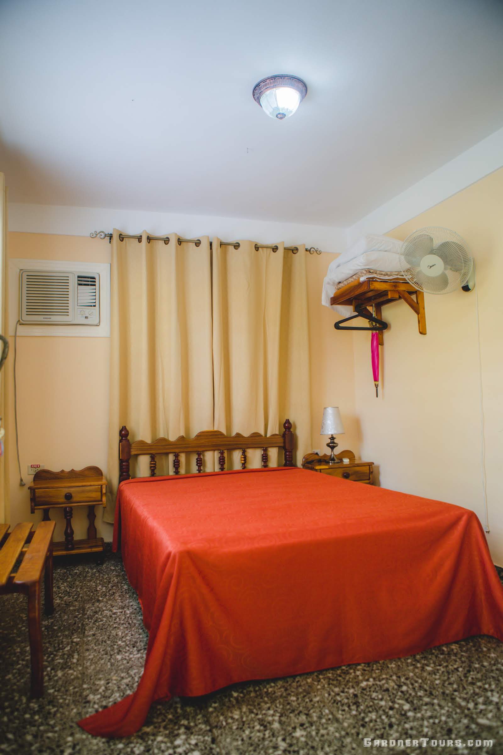 Gardner Tours Base Package red and yellow bedroom at a casa particular BnB in Vinales Cuba