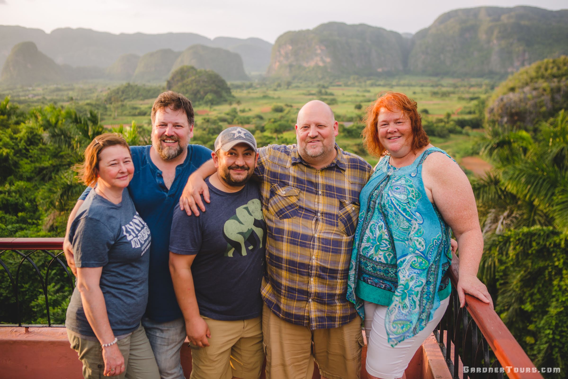 Gardner Tours Vinales Valley Tour Cuba Family Enjoying the Viewpoint of the Viñales Valley at Hotel Los Jazmines