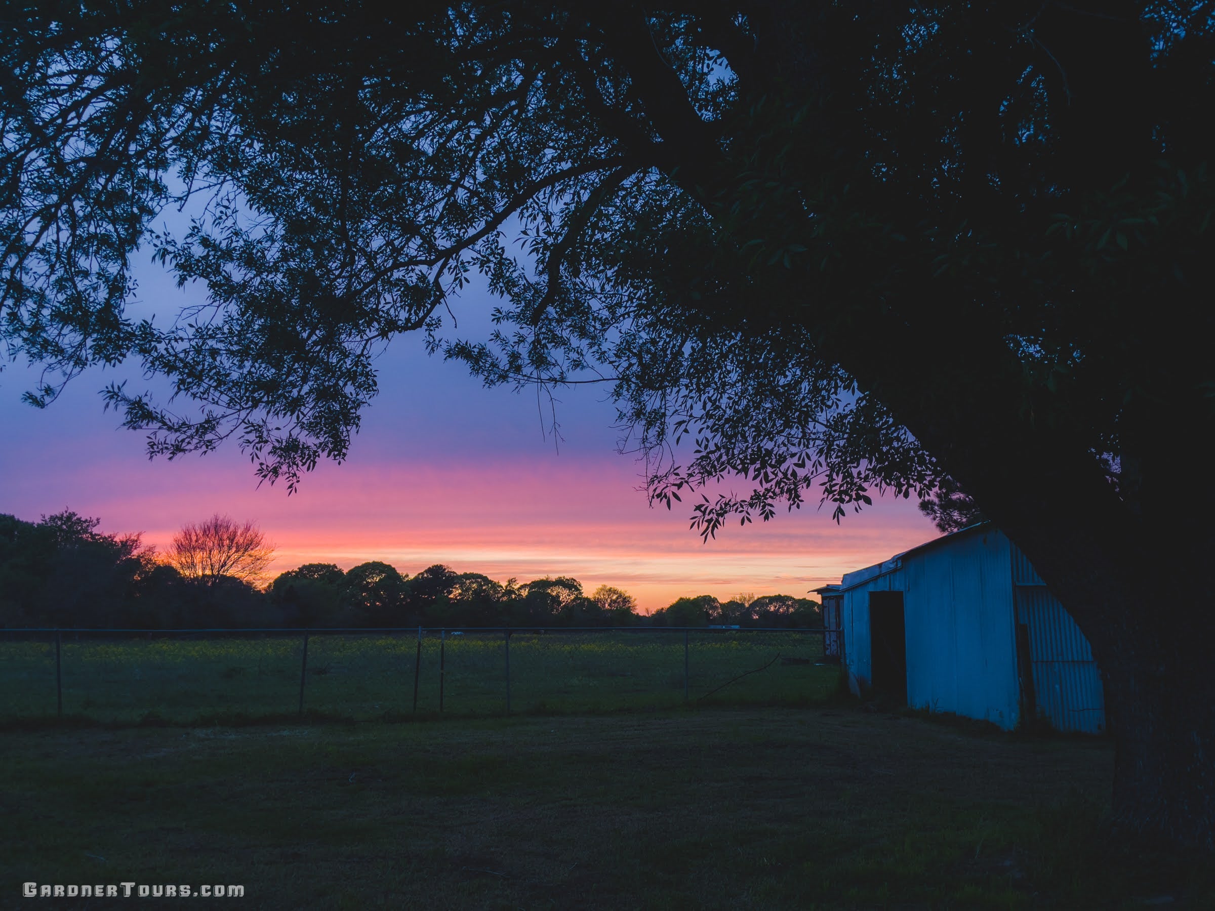 Sunset over a family ranch in Texas Cowboy Country, representing the heritage and hospitality of Gardner Tours.