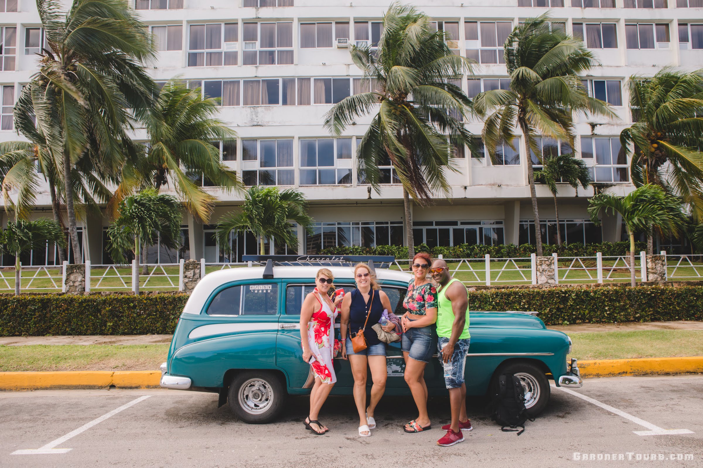 Group of Friends Arriving to the Beach in a Classic Chevrolet Outside of Havana, Cuba