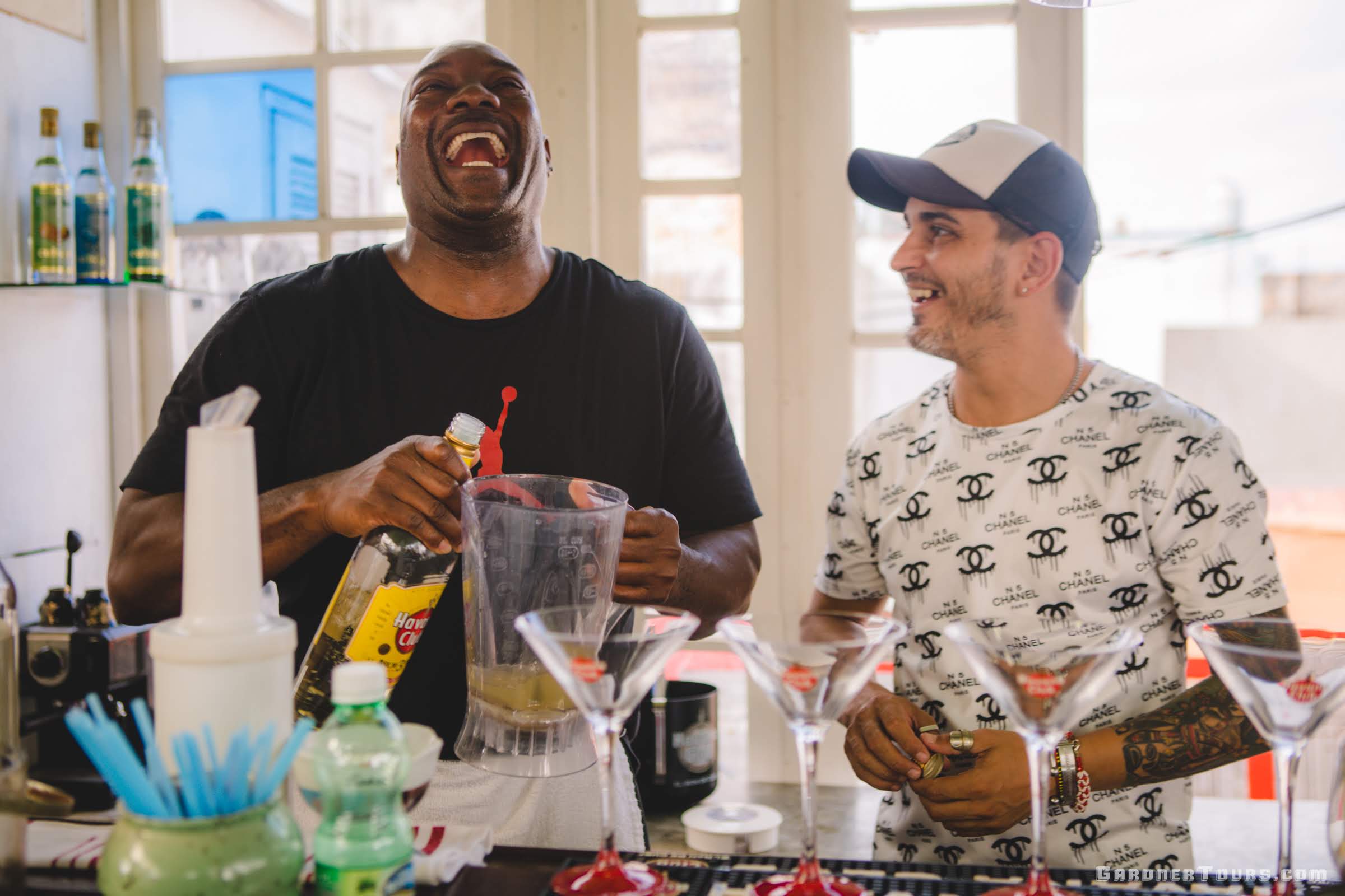 Two Men Making Cuban Cocktails and Laughing Hysterically in Havana Cuba with Havana Club Rum