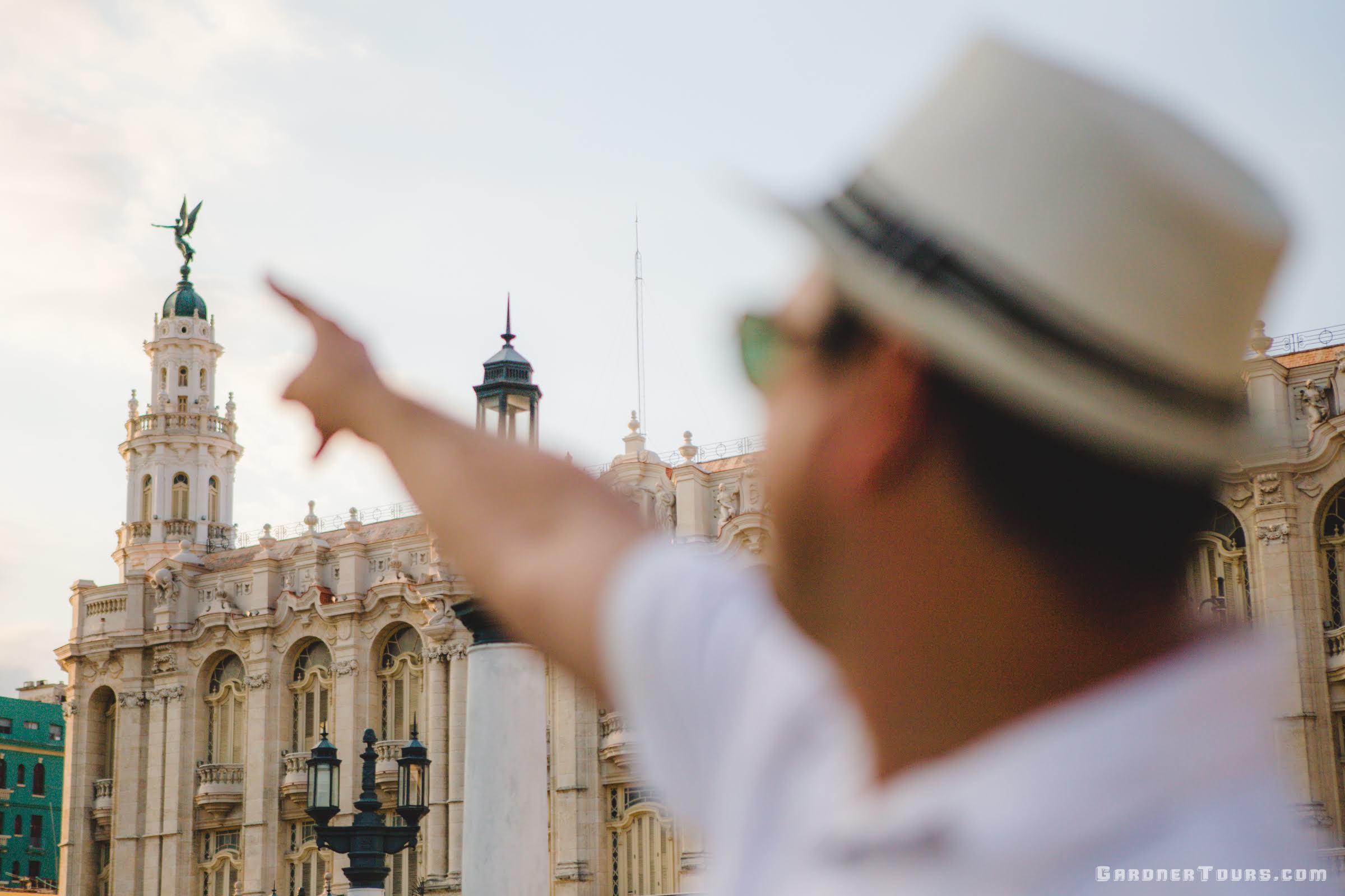 Man Pointing at the Angel on top of the Grand Theatre of Havana, Cuba