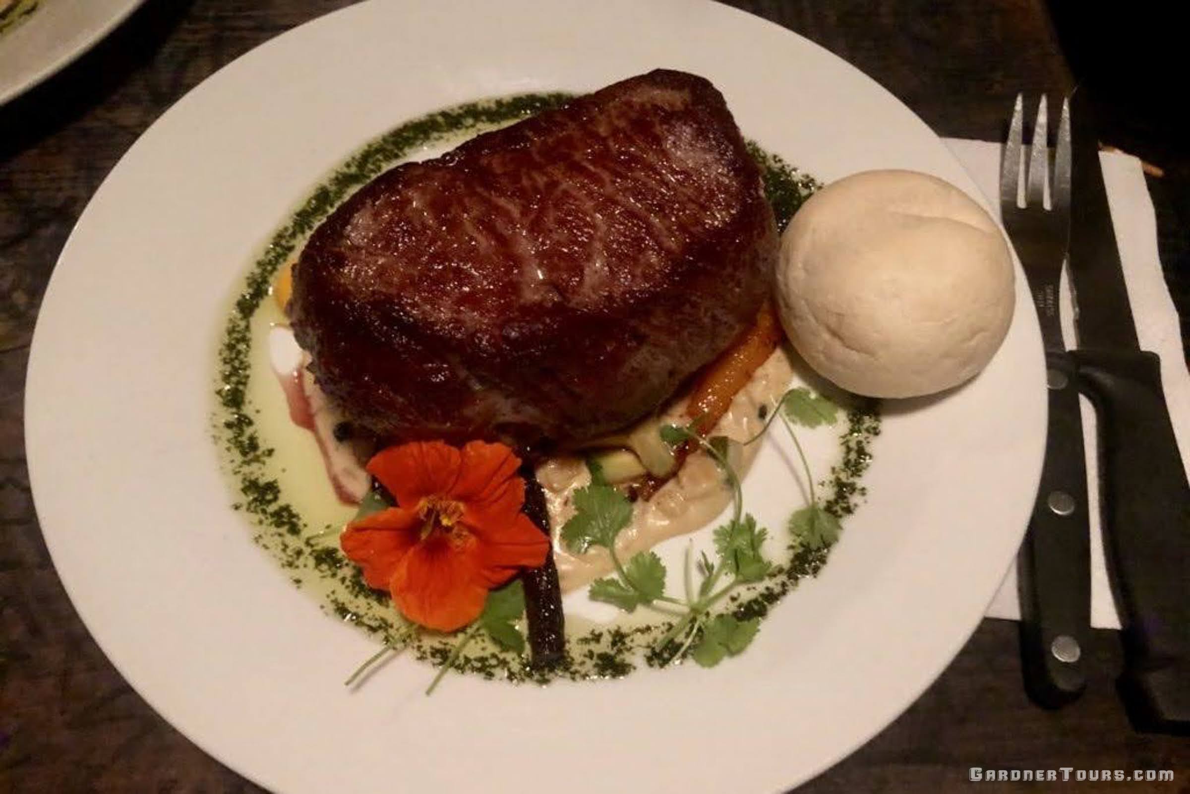 Steak and Potatoes with bread at Por Que No Restaurant in Antigua, Guatemala