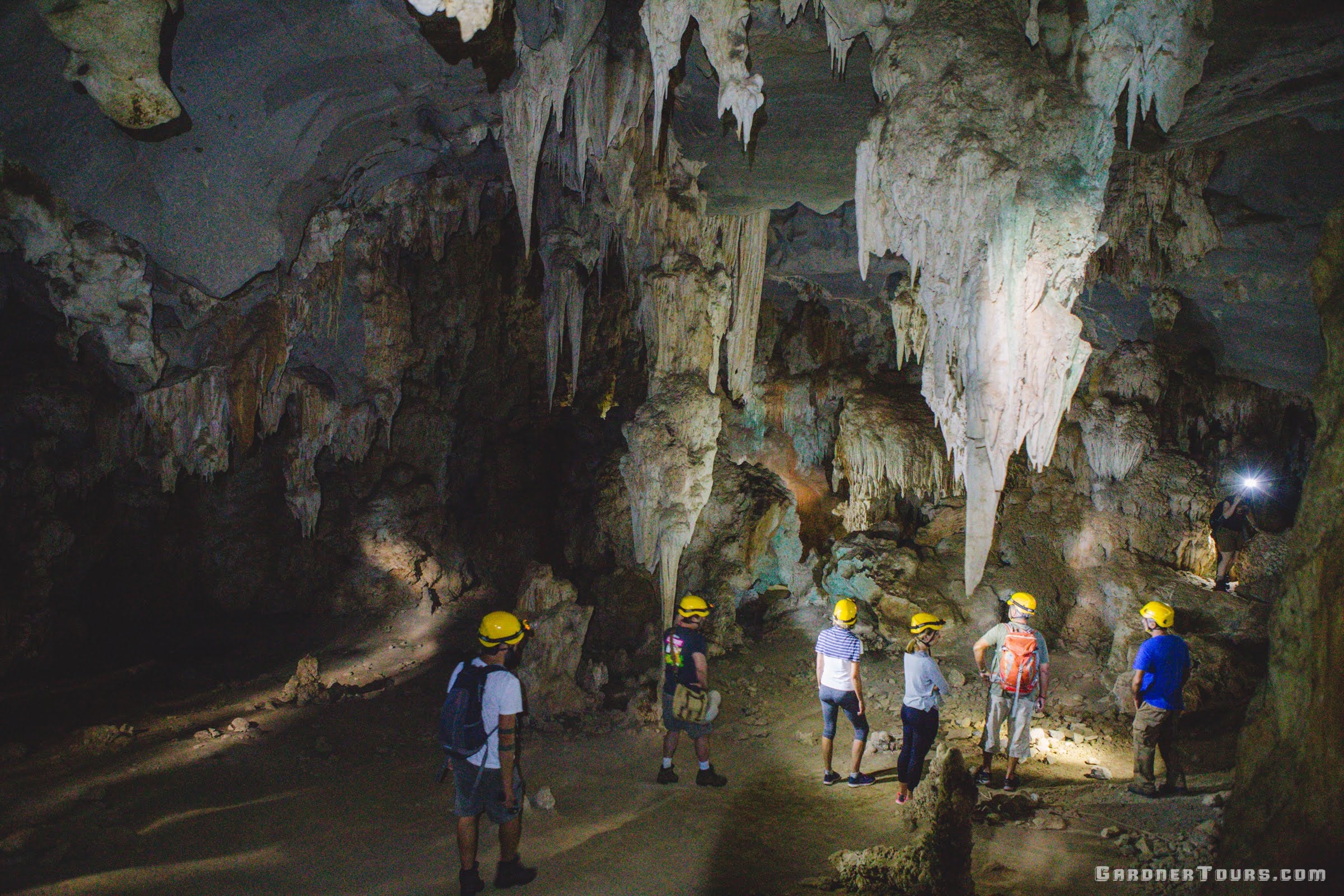 Family Exploring the Caves of Santo Tomas near Vinales, Cuba