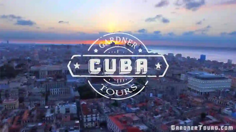 Video still from the Gardner Tours Cuba travel video set to upbeat Cuban music. Highlights include aerial views of Old Havana, classic cars along the Malecón, and Tropicana dancers. Features Viñales mogotes, tobacco fields, traditional cigar rolling, and coffee brewing, followed by a boat ride in Cueva del Indio. Ends with a mojito toast and the Gardner Tours Cuba logo.