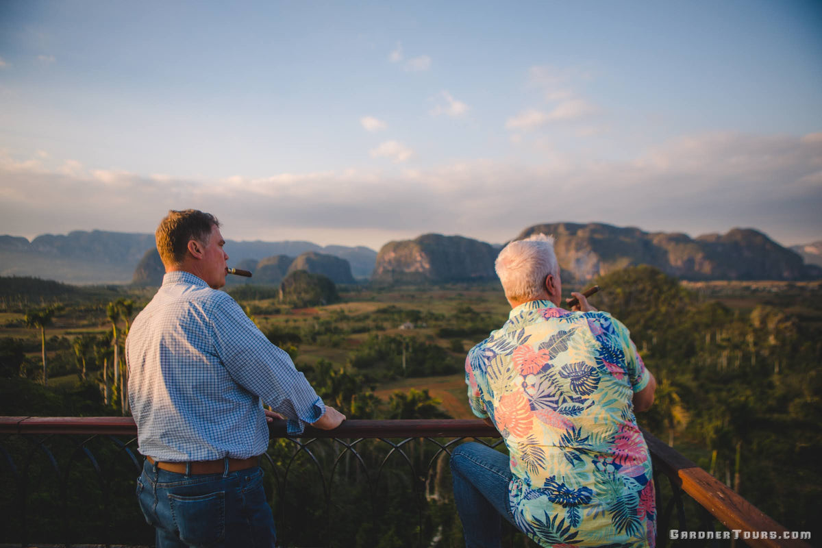 Men Smoking Cigars at Los Jazmines Viewpoint of Vinales Valley in Vinales, Cuba