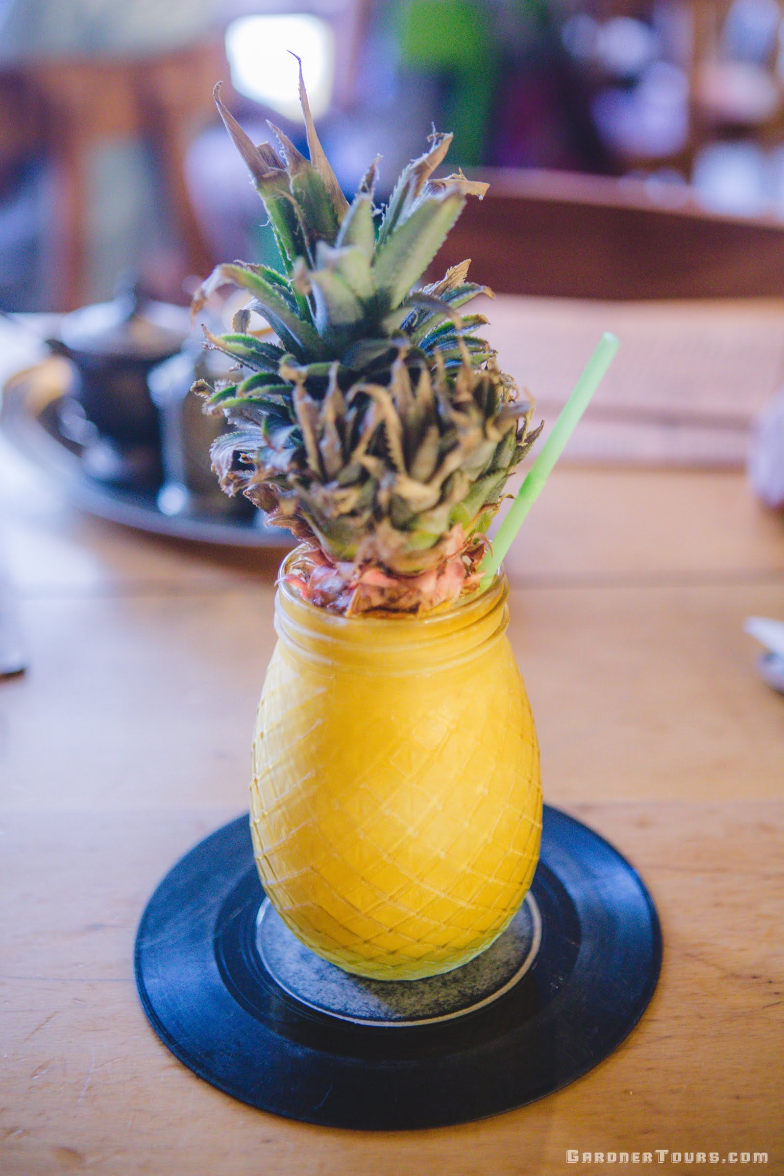 An awesome frozen pineapple daiquiri with the top of a pineapple in Old Havana, Cuba
