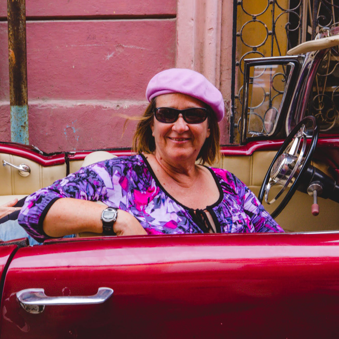 Gardner Tours Cuba Tours Custom Cuba Tour 5 Star TripAdvisor Review by Molly Wren riding in red classic convertible car