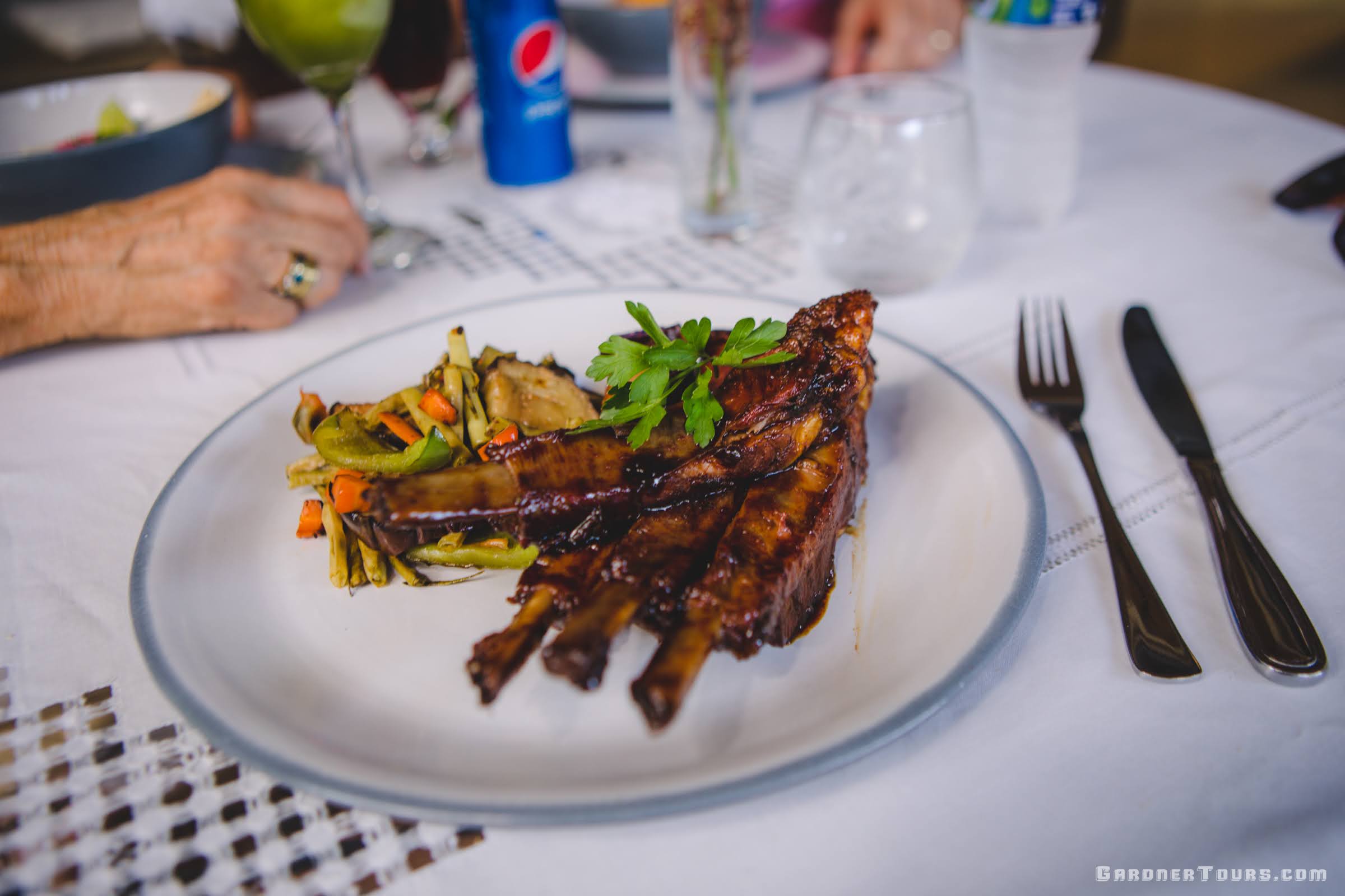 Delicious Cuban BBQ Pork Ribs with Sauteed Vegetables at 5-Star Restaurant Paladar La Bodega in Vedado, Havana, Cuba