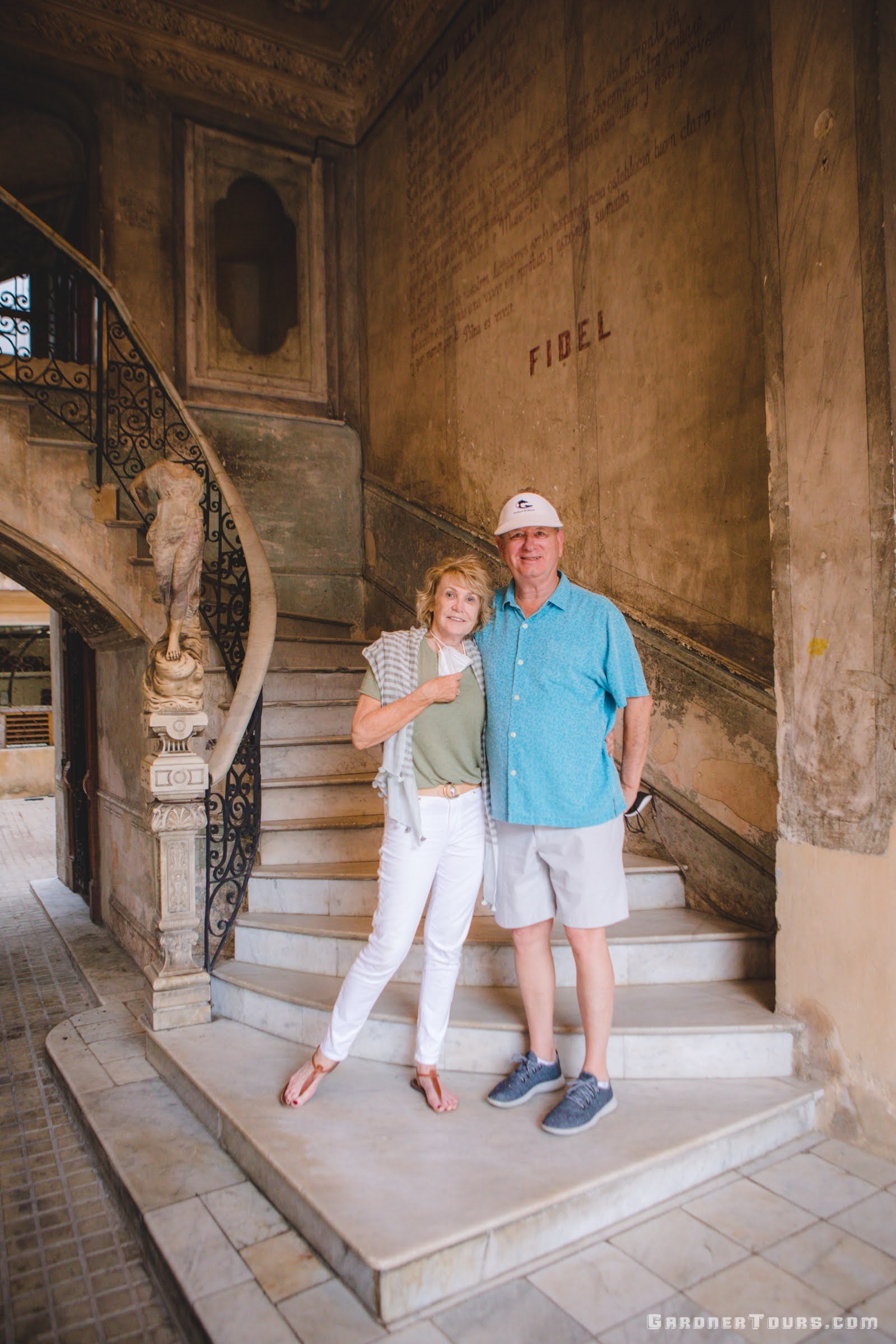 Gorgeous Couple Posing by the Marble Staircase at 5-Star Restaurant Paladar La Guarida in Central Havana, Cuba