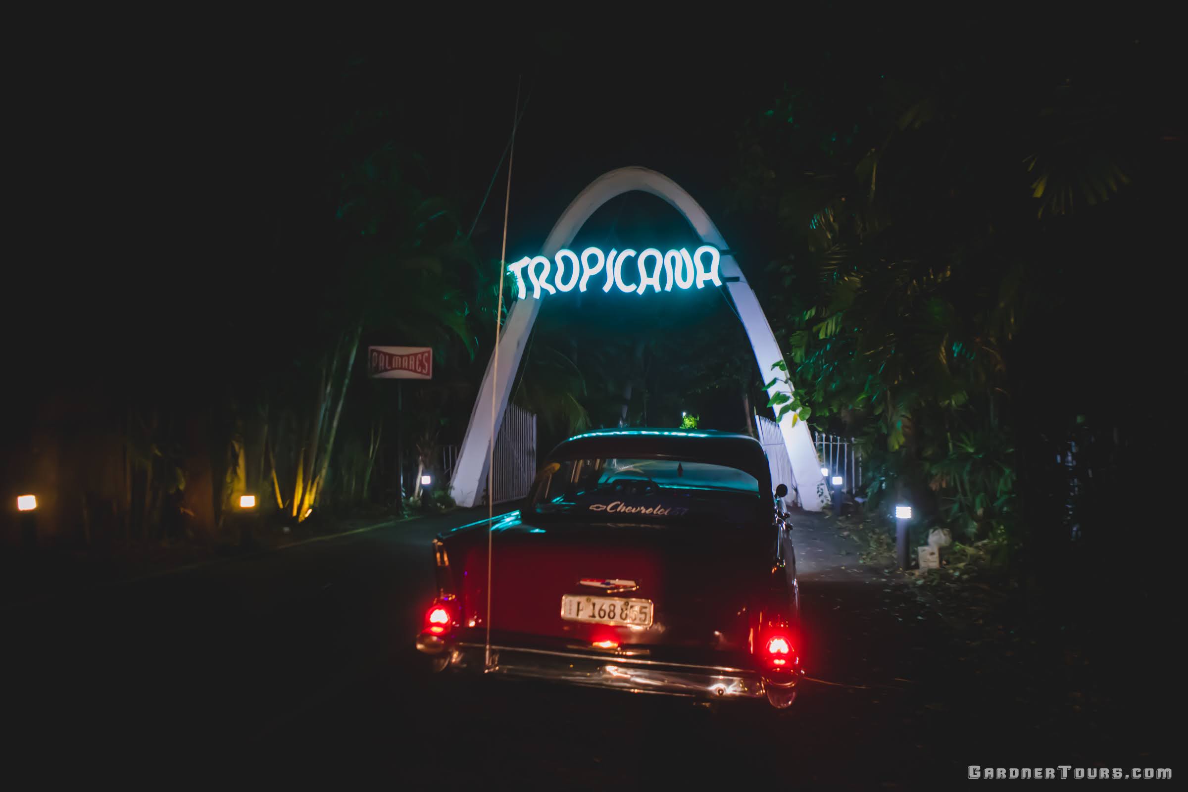 A Maroon 1957 Chevrolet Bel Air at the Front Entrance of the Tropicana Cabaret's Big Show in Havana, Cuba