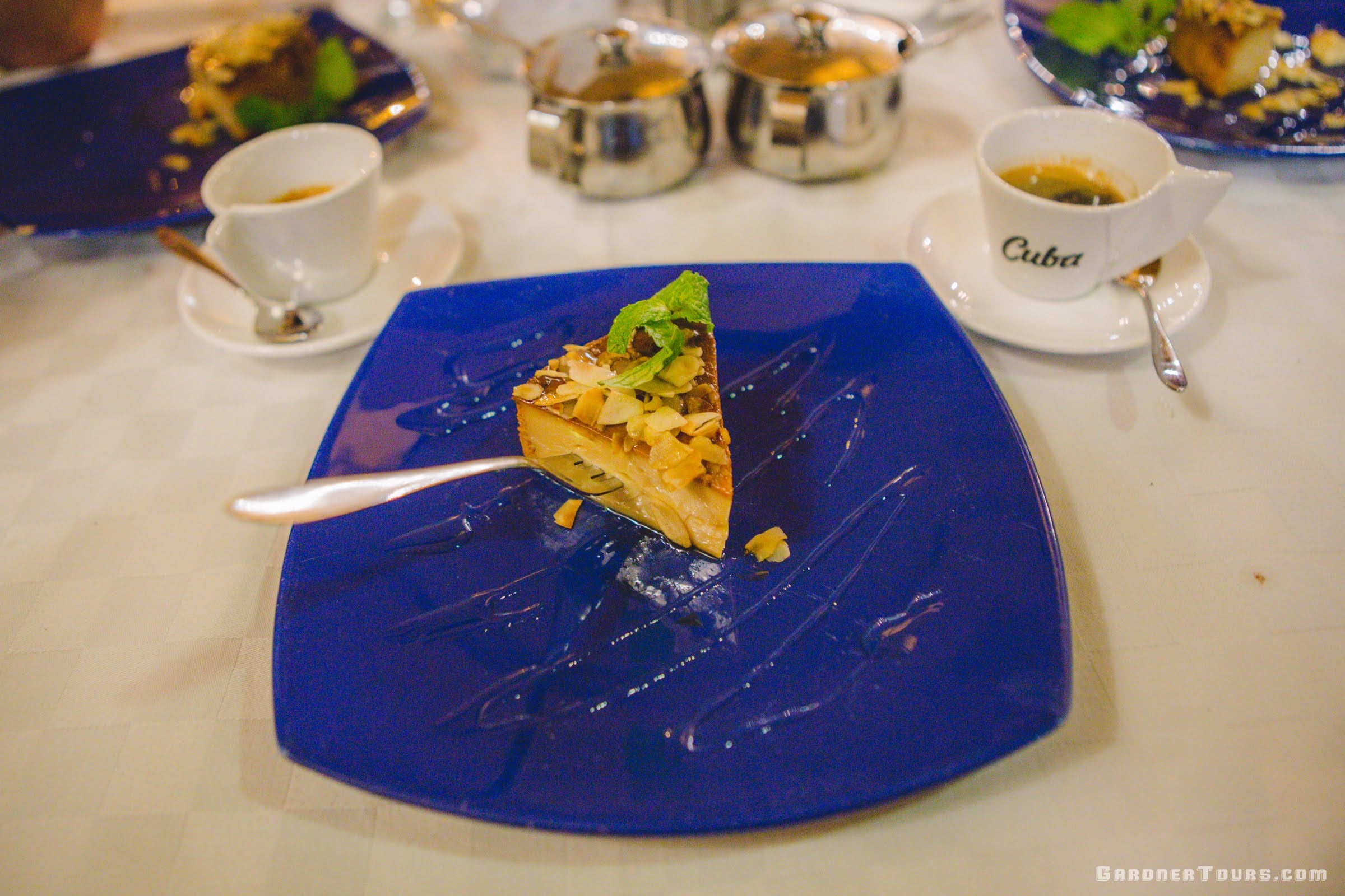 An amazing Flan Glazed in Honey on a Blue Plate with Cuban Coffee at Restaurant Paladar Esto no es un Café in Old Havana, Cuba