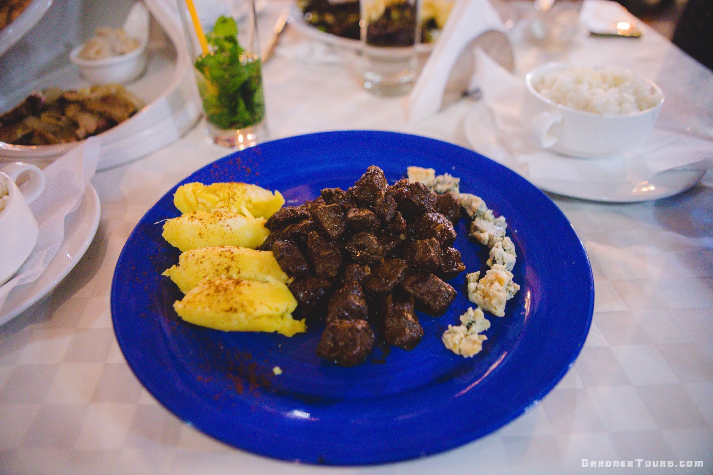 The Best Dinner Plate called Klein Bleu made with Lamb, Boñato, and Bleu Cheese on a Blue Plate at Restaurant Paladar Esto no es un Café in Old Havana, Cuba