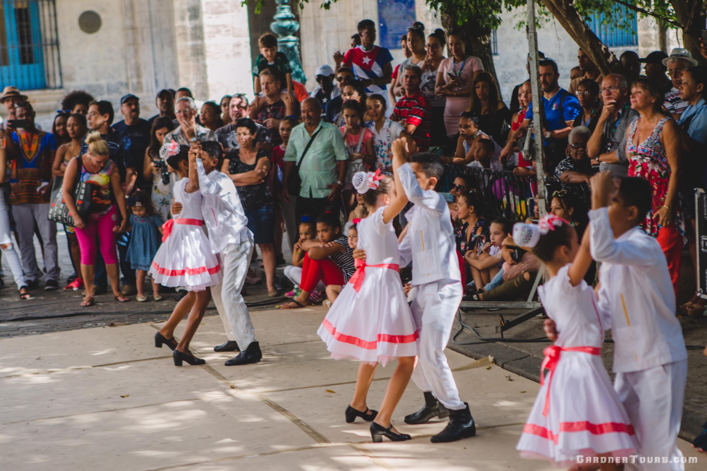 Kids Dancing in traditional Cuban dress at the Plaza de Armas in Havana, Cuba
