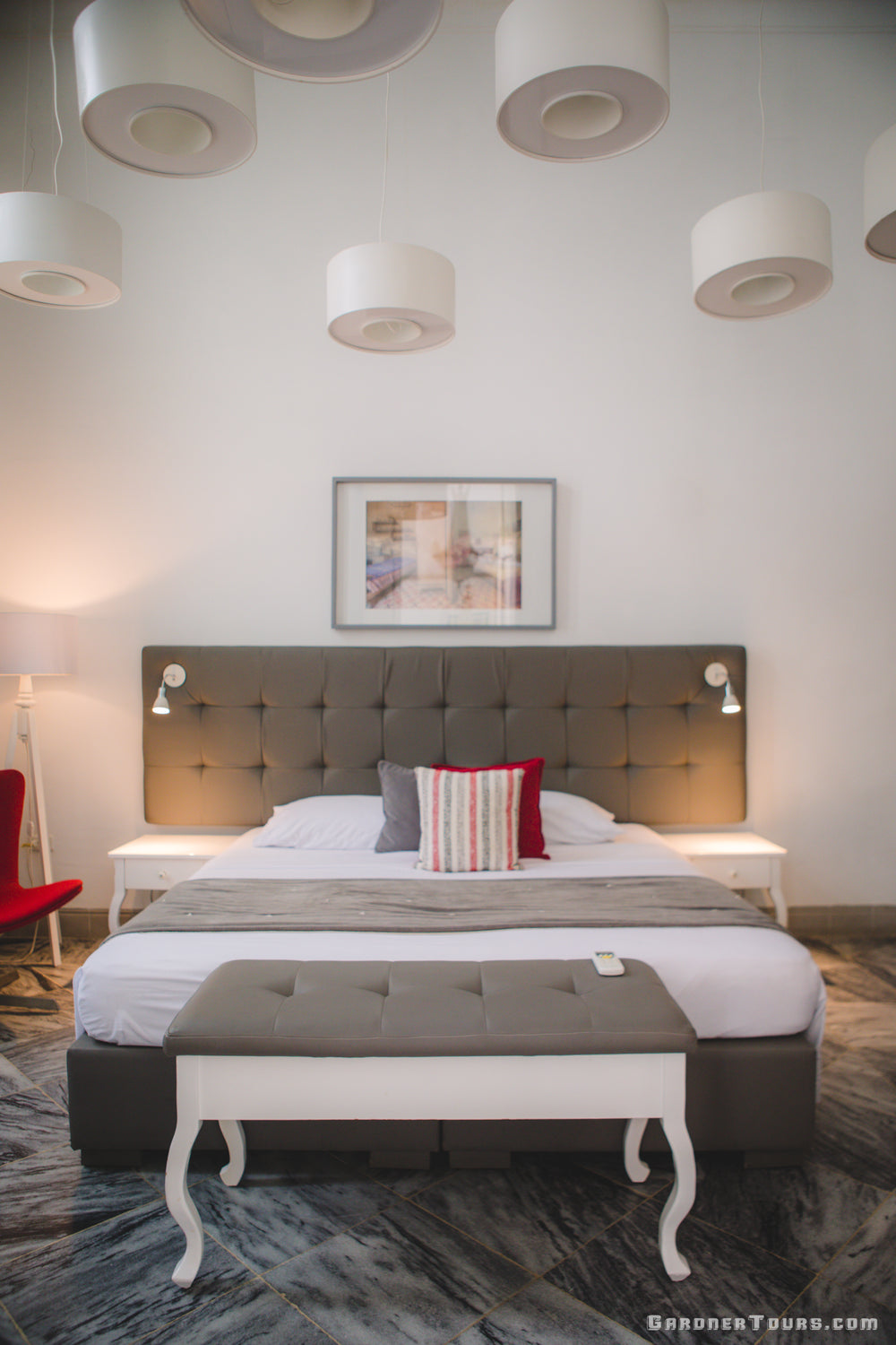 Luxurious Bedroom with Lush Bed and Hanging Lights in 4-Star BnB in Old Havana, Cuba