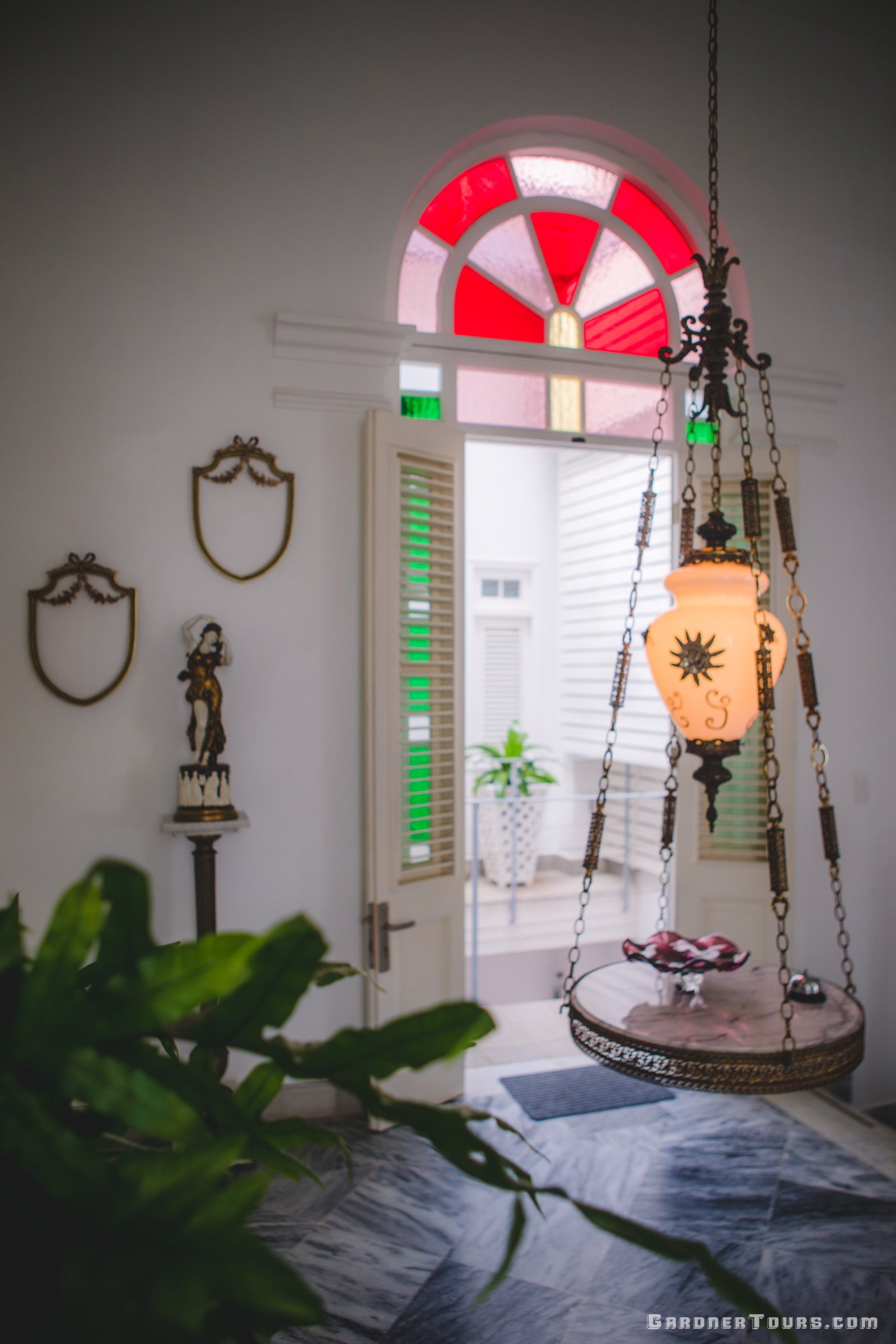 Breezeway with Classic Cuban Decorations and Stained Glass in a 4-Star BnB in Old Havana, Cuba