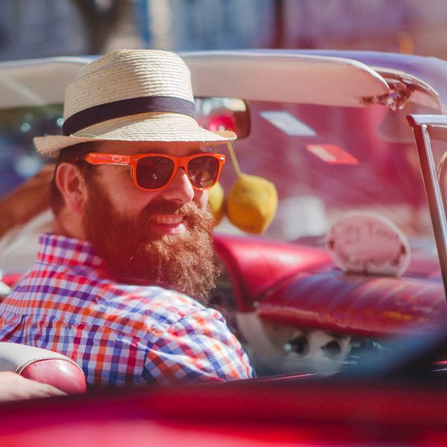 Colby Gardner, Owner of Gardner Tours Looking Hip In a Cool Red Convertible Car