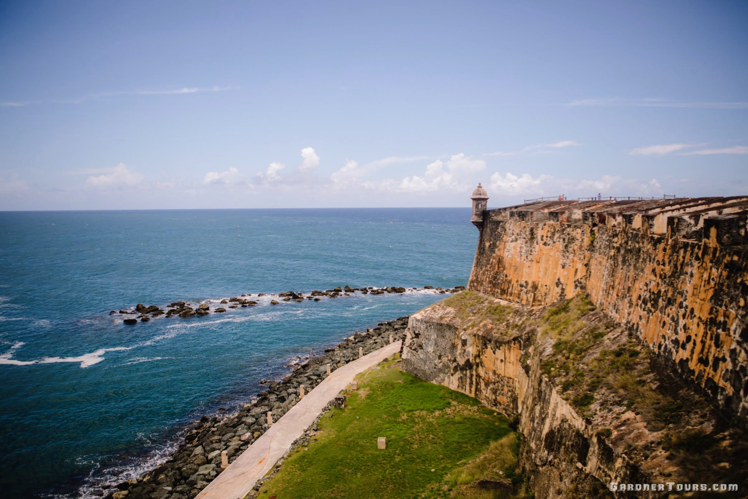 A beautiful view from a window in the El Morro Castle in San Juan Puerto Rico with part of the castle and the waters in view