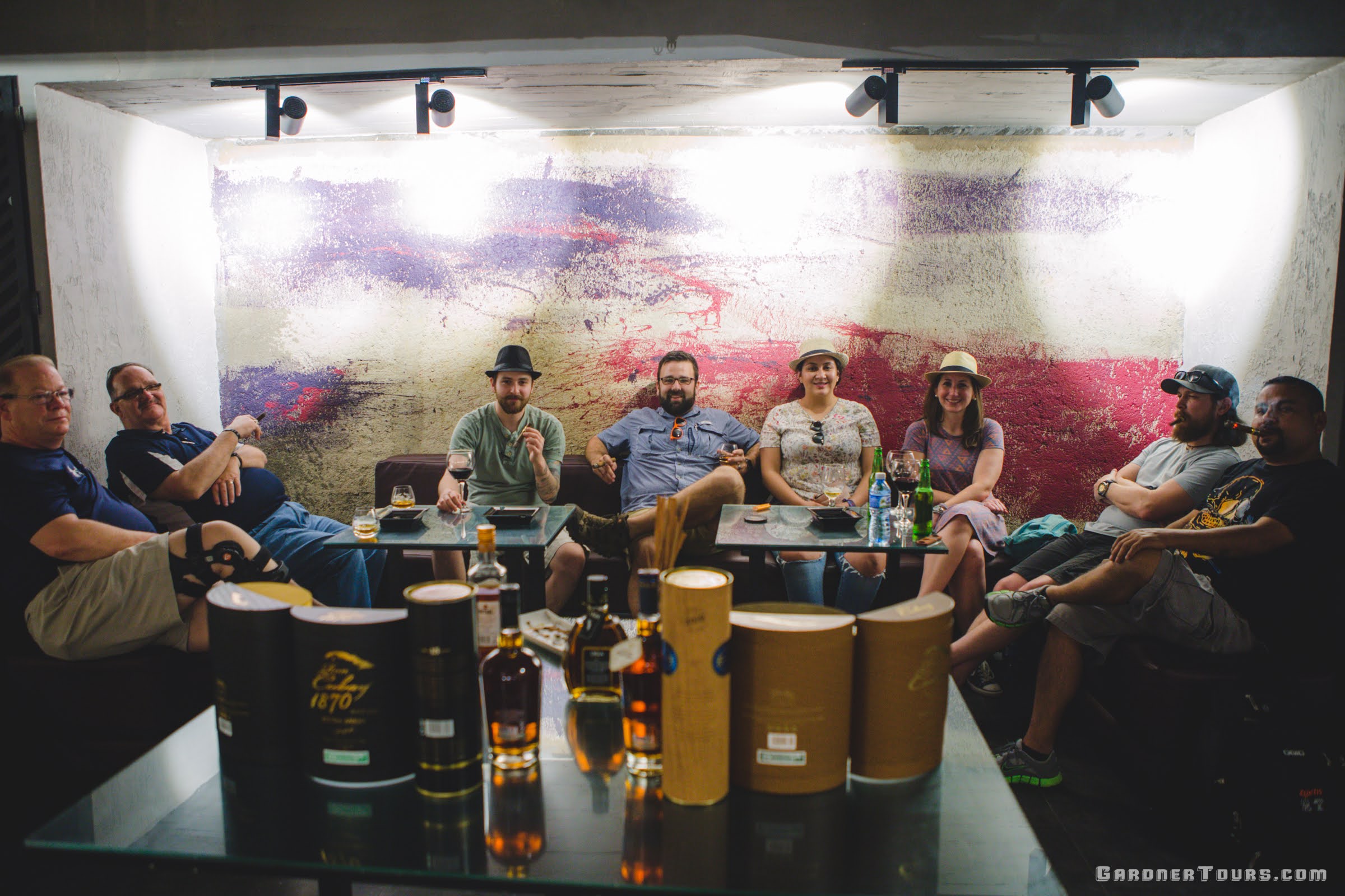 Gardner Tours Owner and Tour Guide Colby Gardner enjoying a cigar pairing with his American travelers at La Cava under the Grand Theatre of Havana in Havana, Cuba