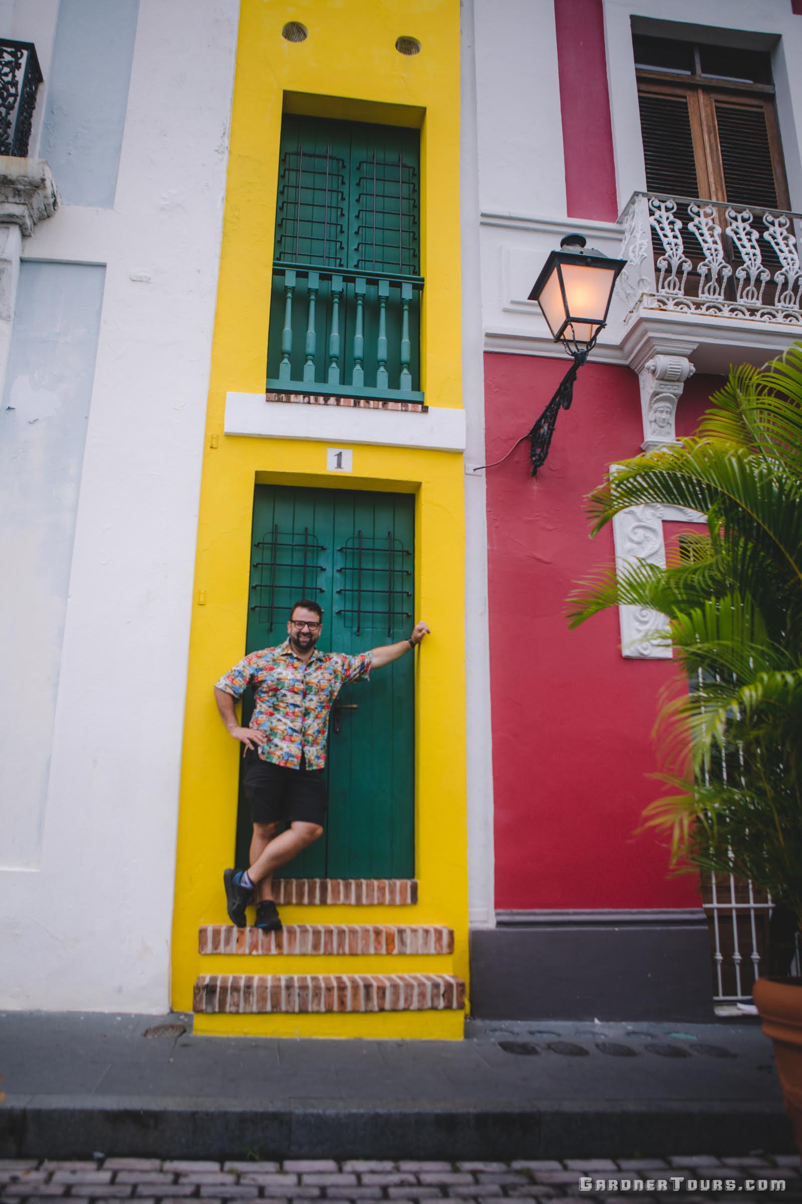 Gardner Tours Owner and Tour Guide Colby Gardner in front of the world's most narrow home in San Juan, Puerto Rico