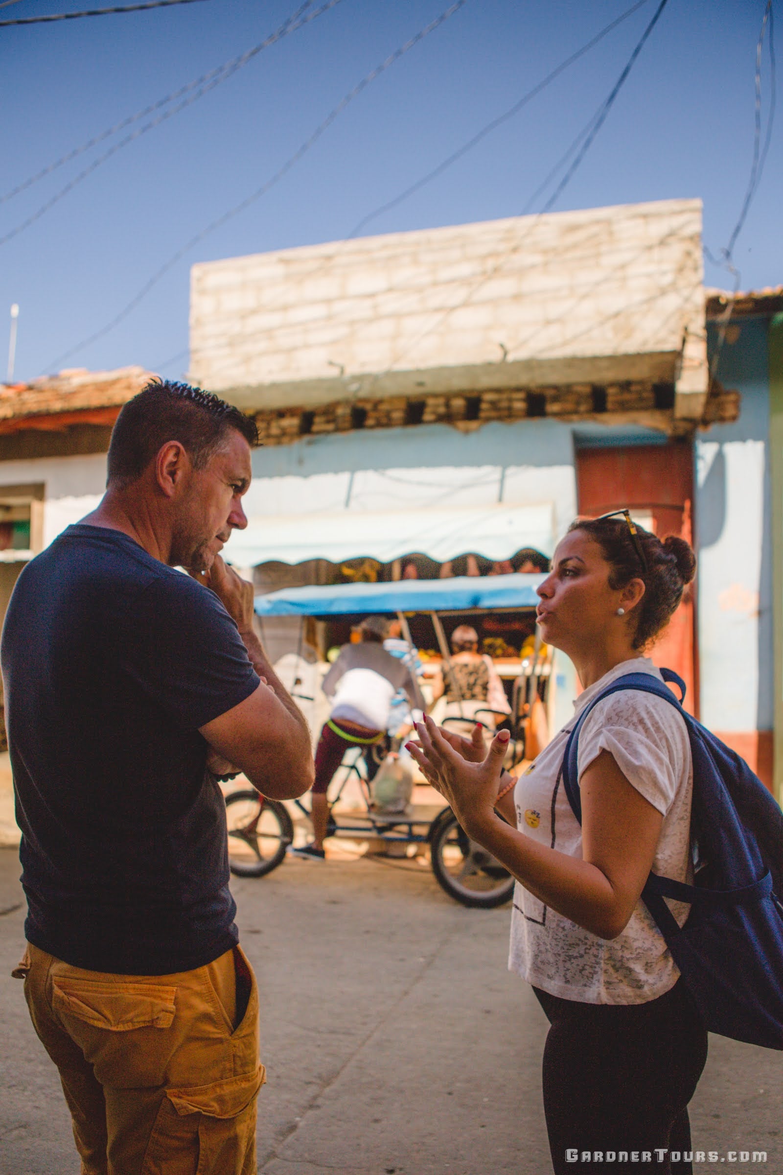 Gardner Tours Cuban Tour Guide Zeydi explaining how Cuban rations work to her Dutch travelers in Trinidad Sancti Spiritus Cuba
