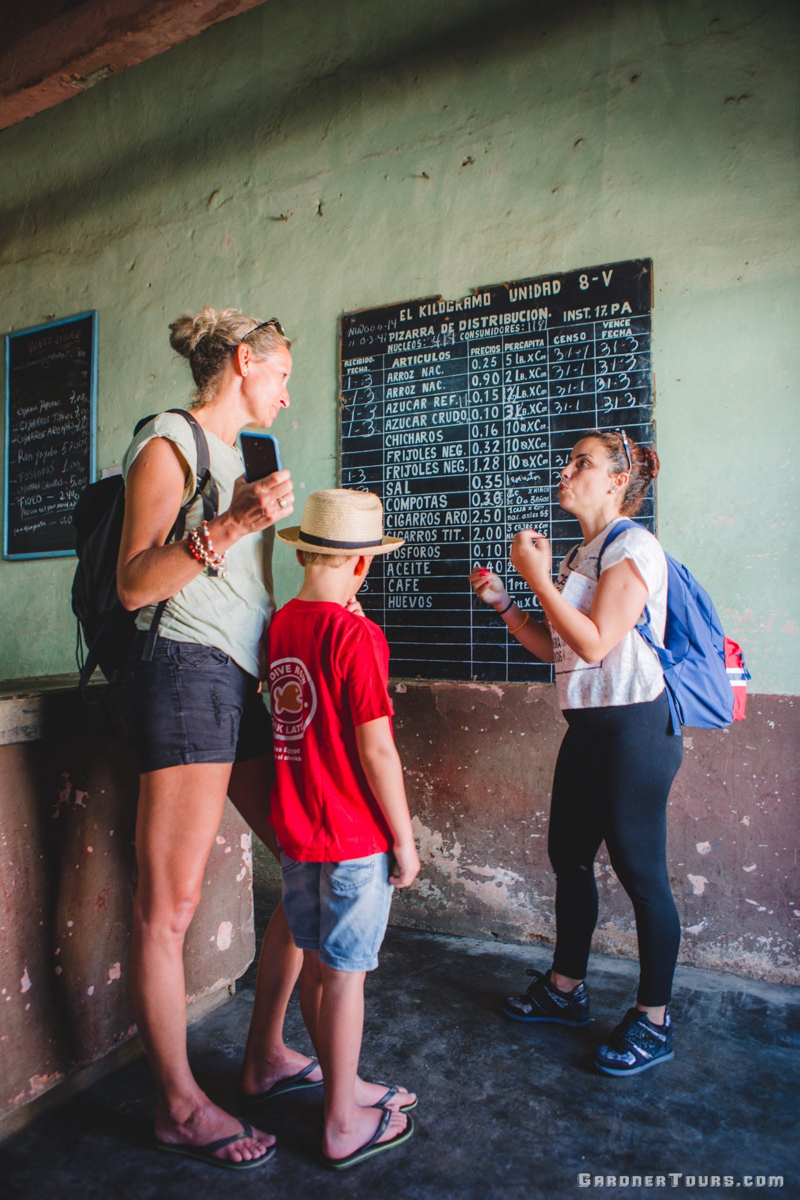 Gardner Tours Cuban Tour Guide Zeydi explaining to her Dutch Travelers how Cuban Rations work across the country