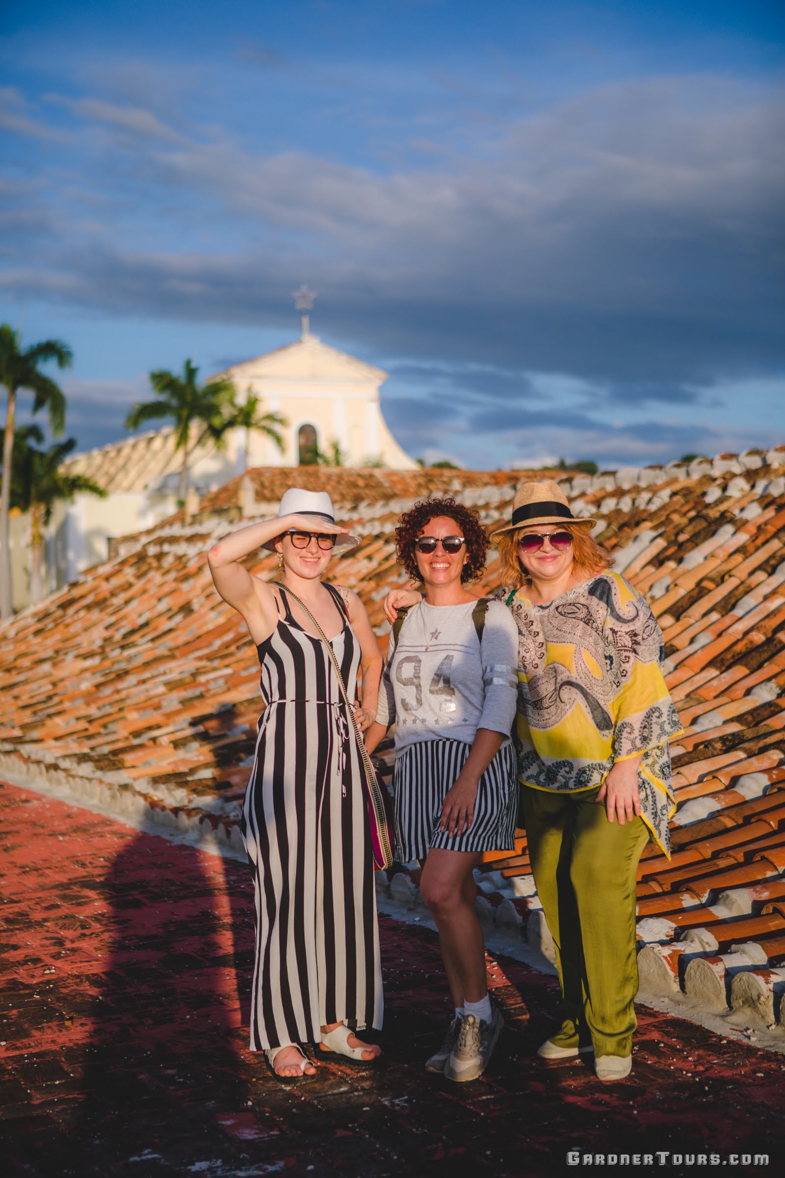 Gardner Tours Cuban Tour Guide Zeydi with two travelers on the rooftop of the Palacio de Cantero in Trinidad Sancti Spiritus Cuba