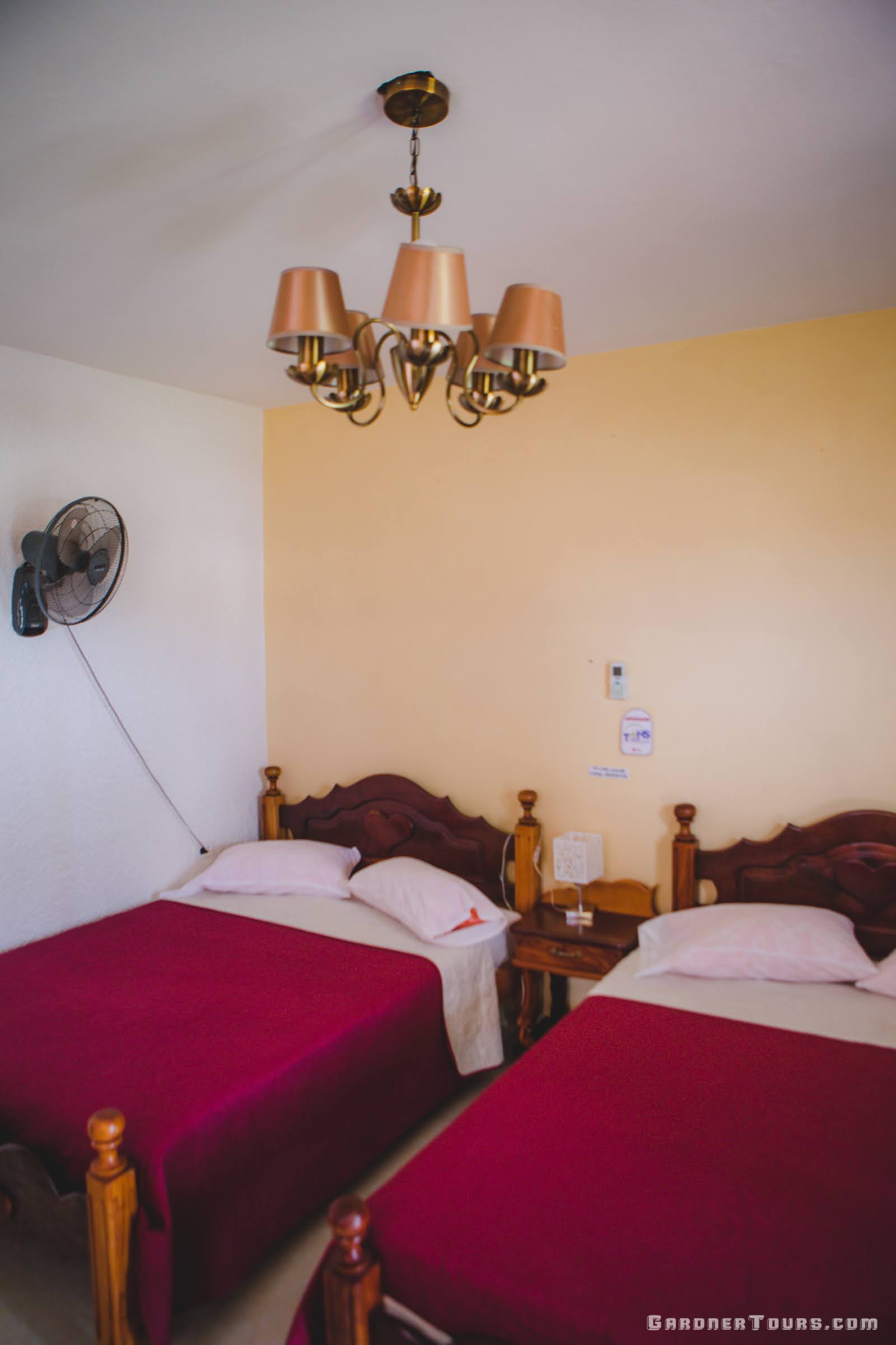 Bedroom view with two regular size beds of a 3-Star Casa Particular BnB in Viñales, Cuba