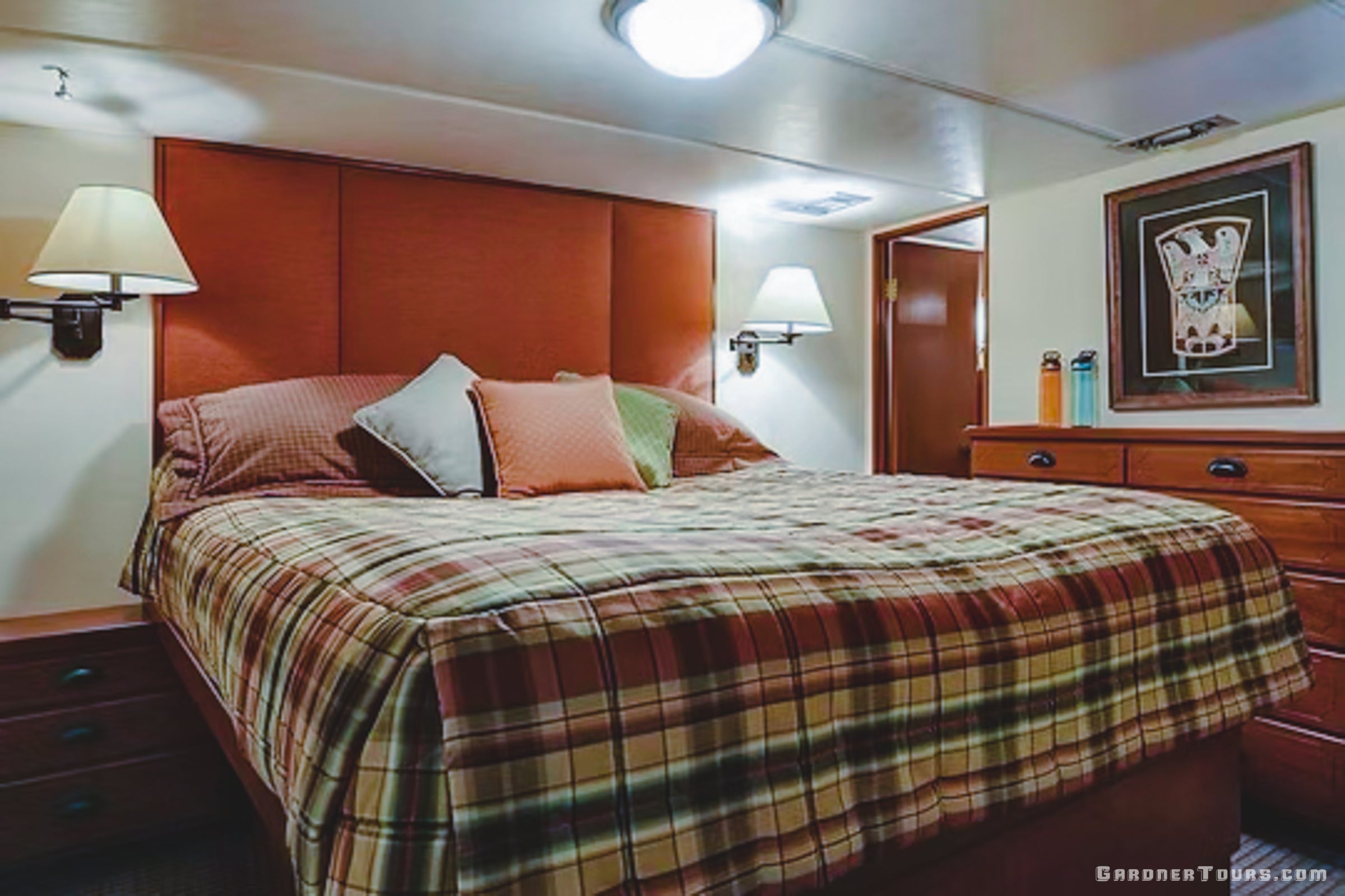 The luxury Petersburg Master Suite on the yacht featuring a king bed and upscale interior design.