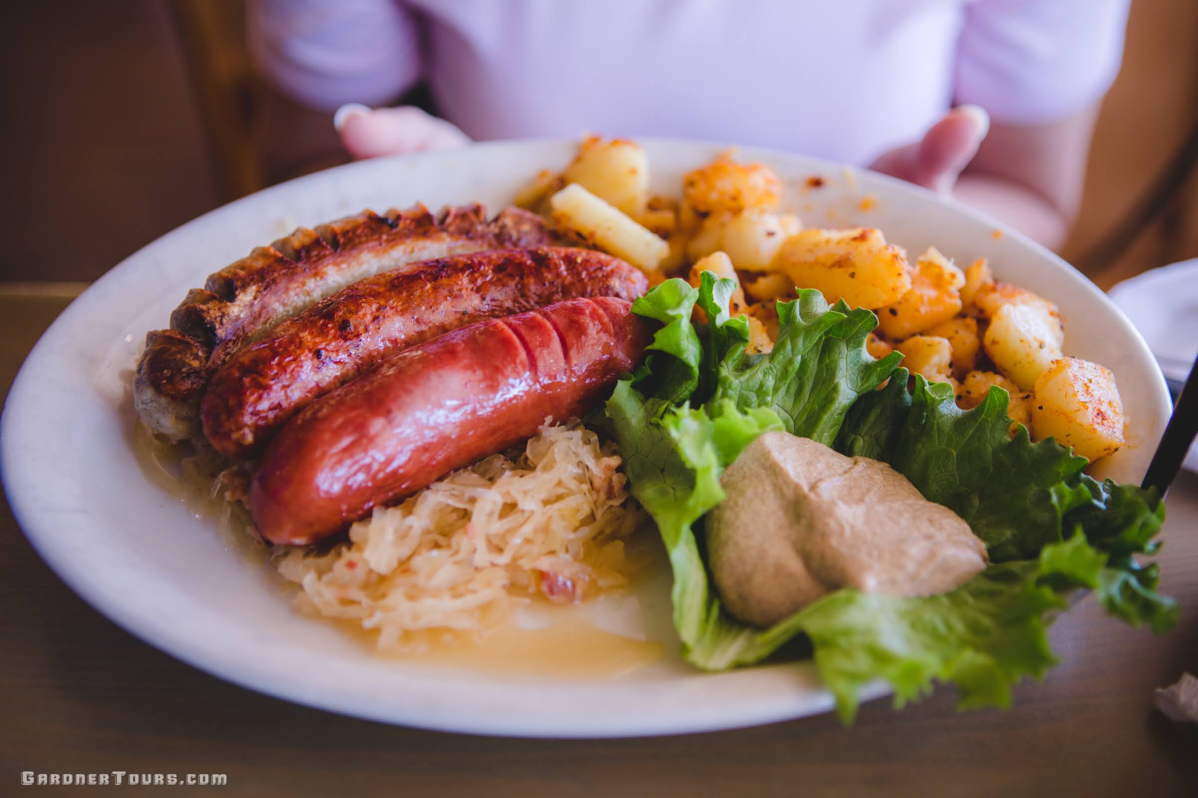 A big breakfast plate of German food and sausage at the Old German Bakery in Fredericksburg, Texas.