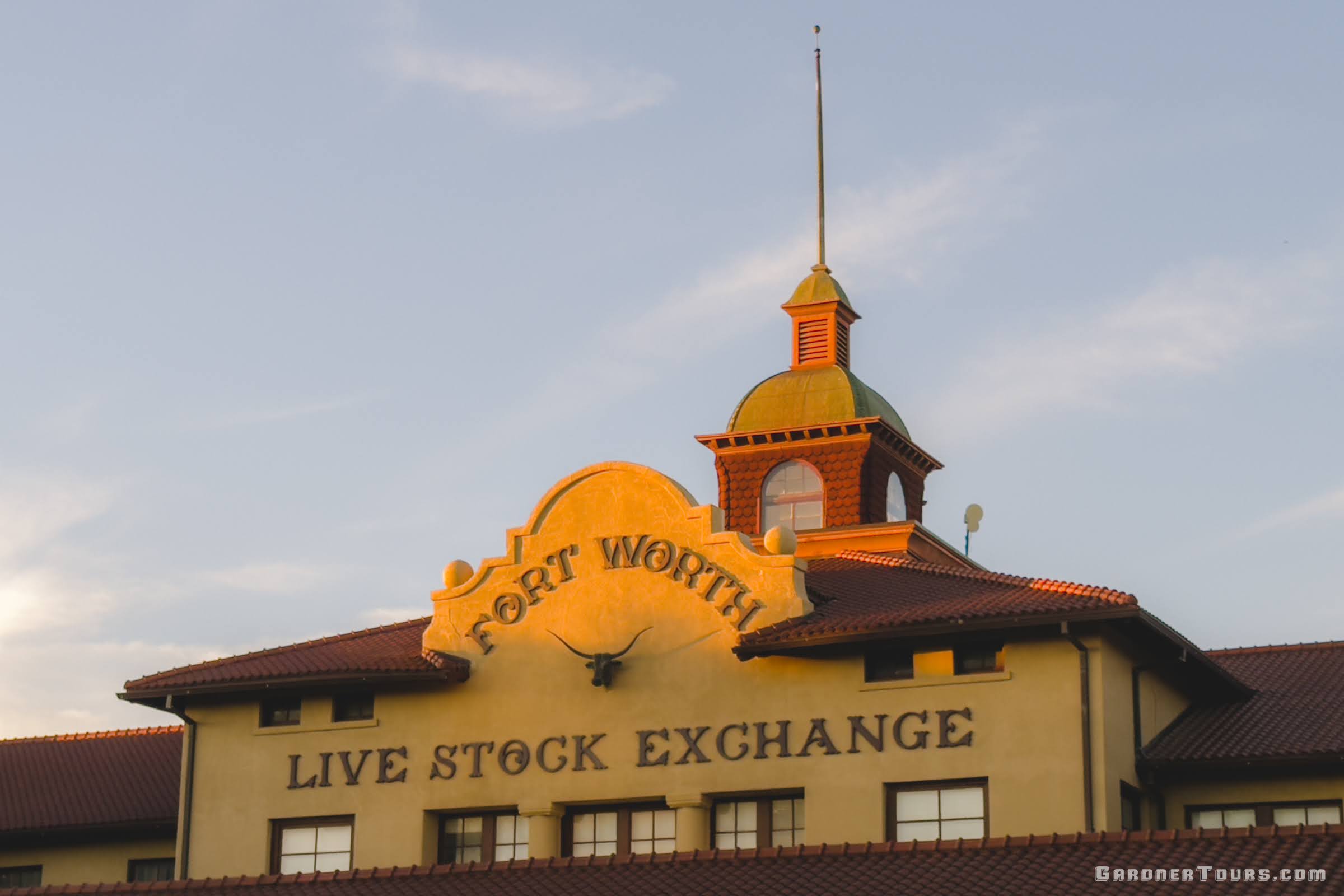 Brown and tan building front of the Fort Worth Live Stock Exchange in the Fort Worth Stockyards.