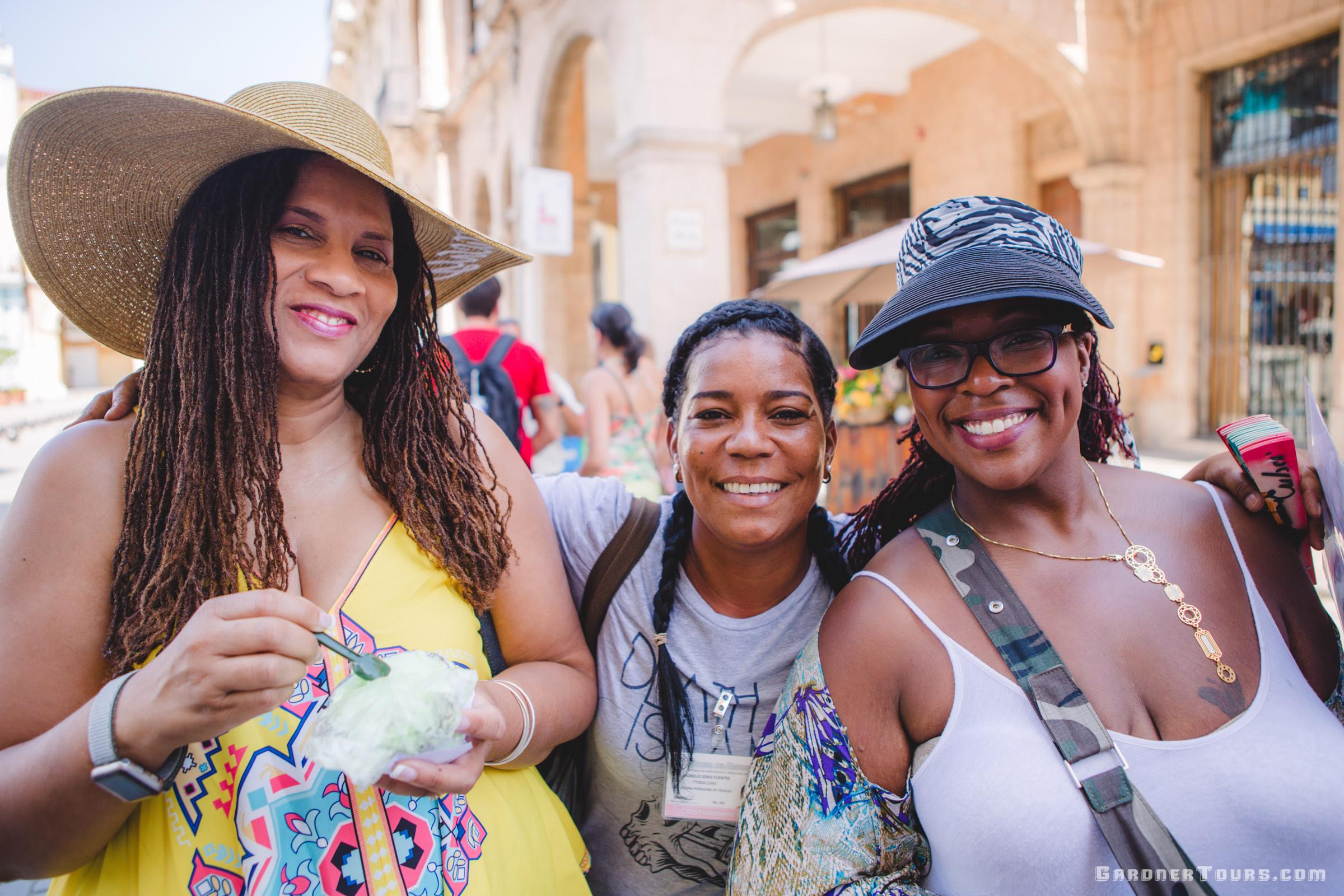 Two Ladies Smiling with Local Cuban Woman in Old Havana, Cuba