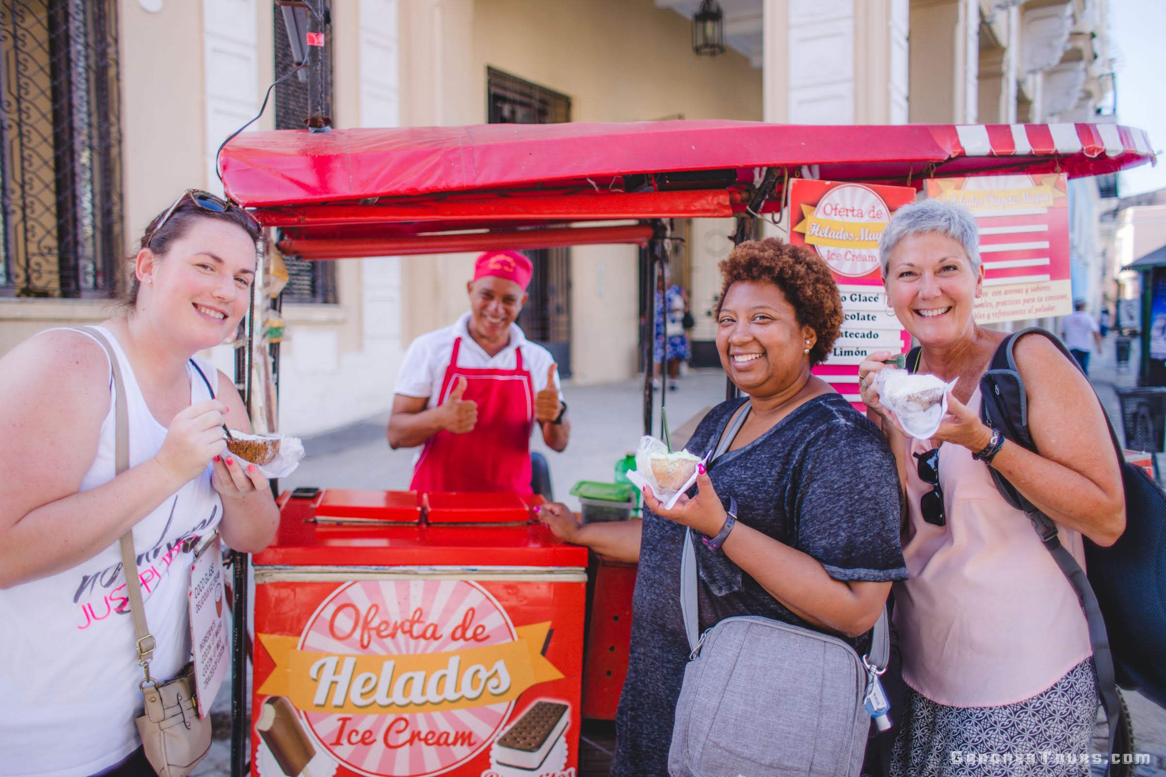 Three Women and Friends Eating Ice Cream in Plaza Vieja Old Havana, Cuba